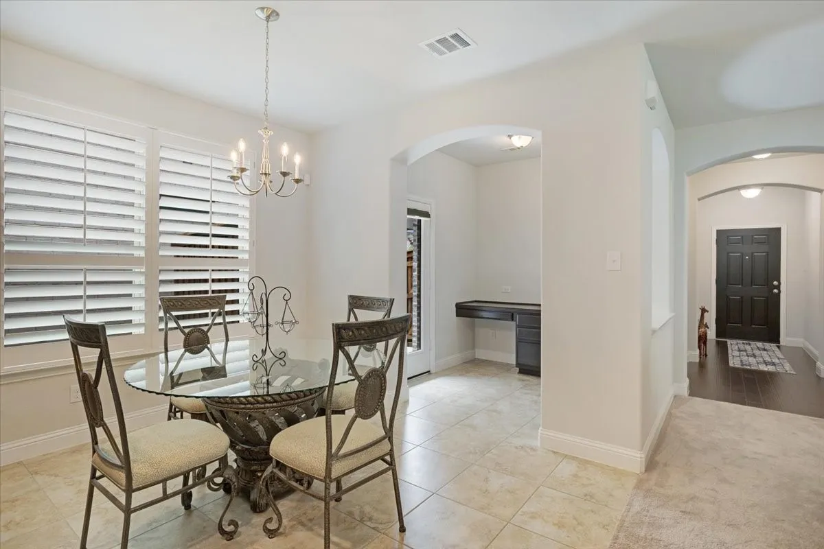 Recessed lighting illuminates the entryway