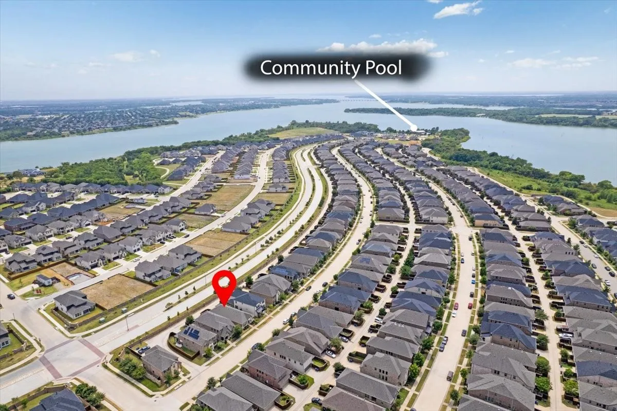 Aerial perspective of a developed residential community with consistent architectural styles.
