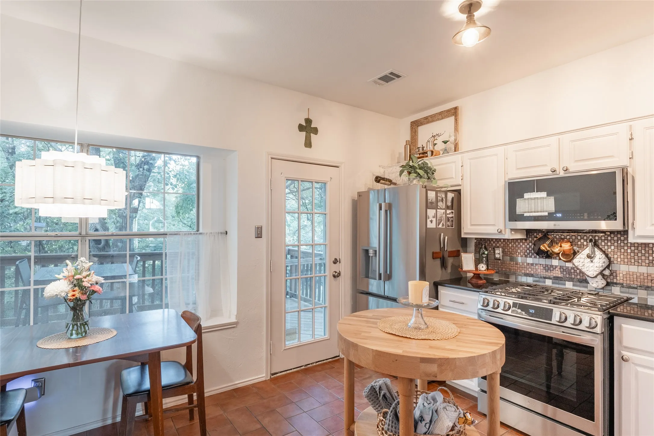 White cabinetry with dark countertops