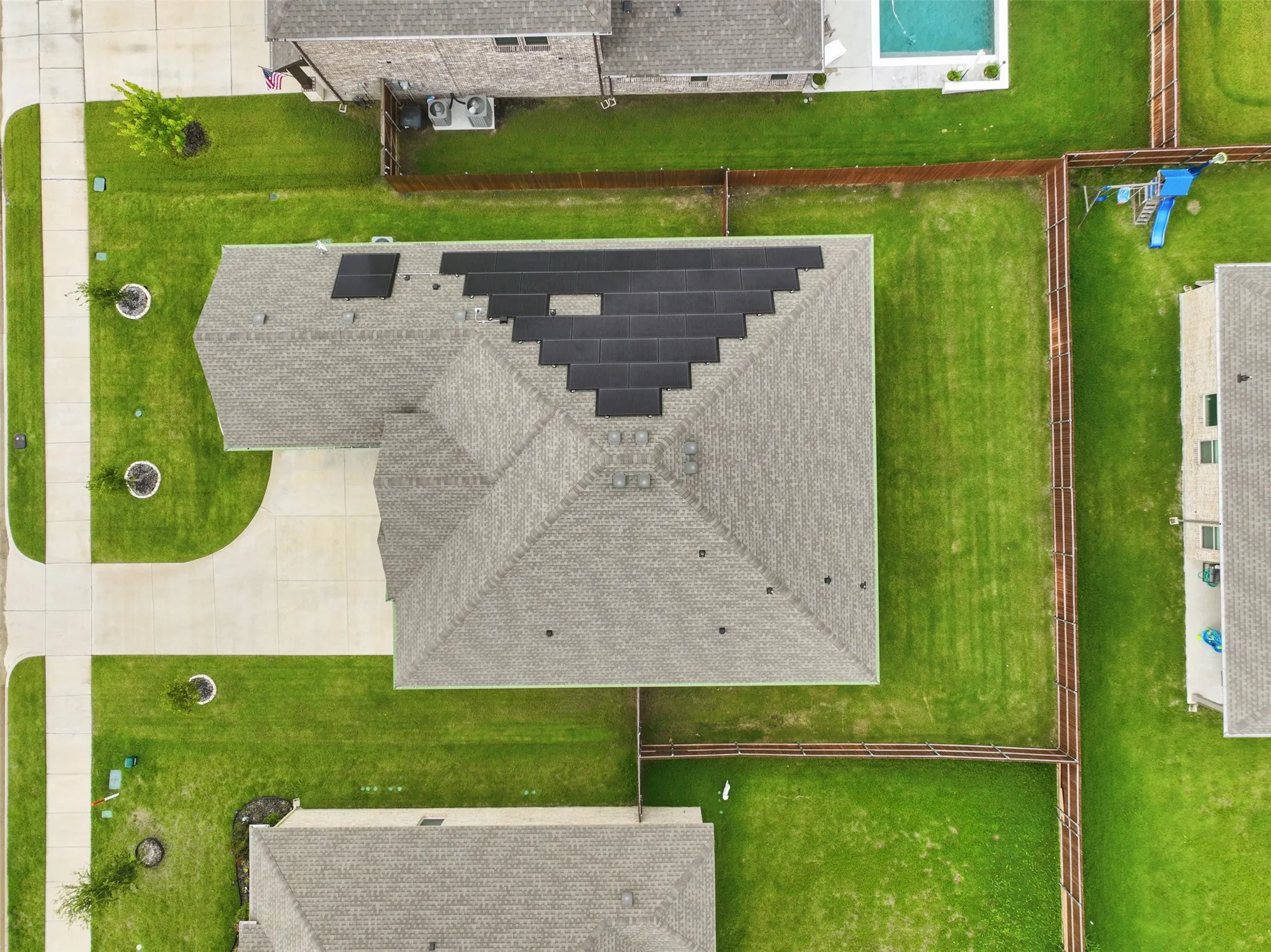 Asphalt shingle roof with solar panels