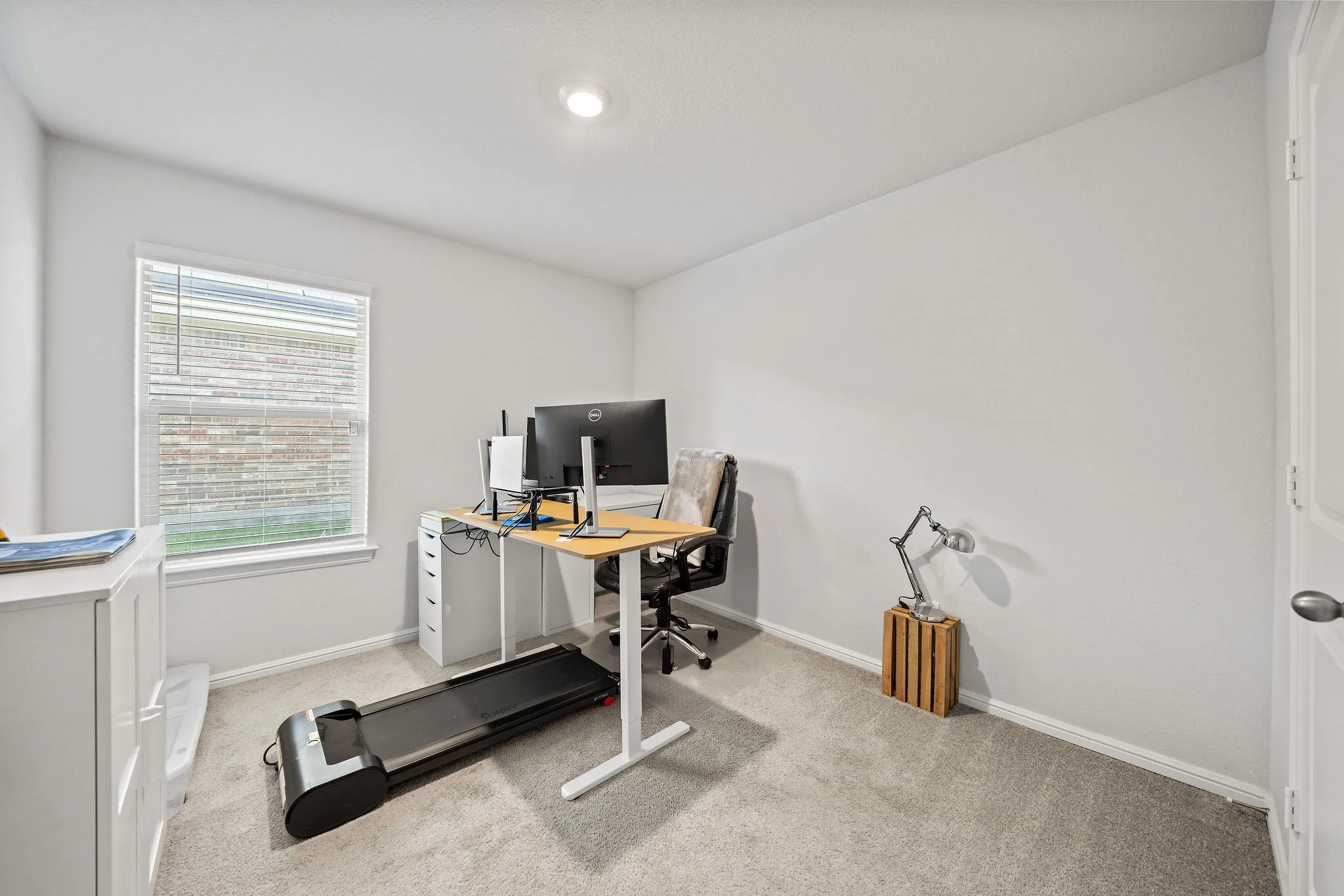 Office with carpet floors and baseboards