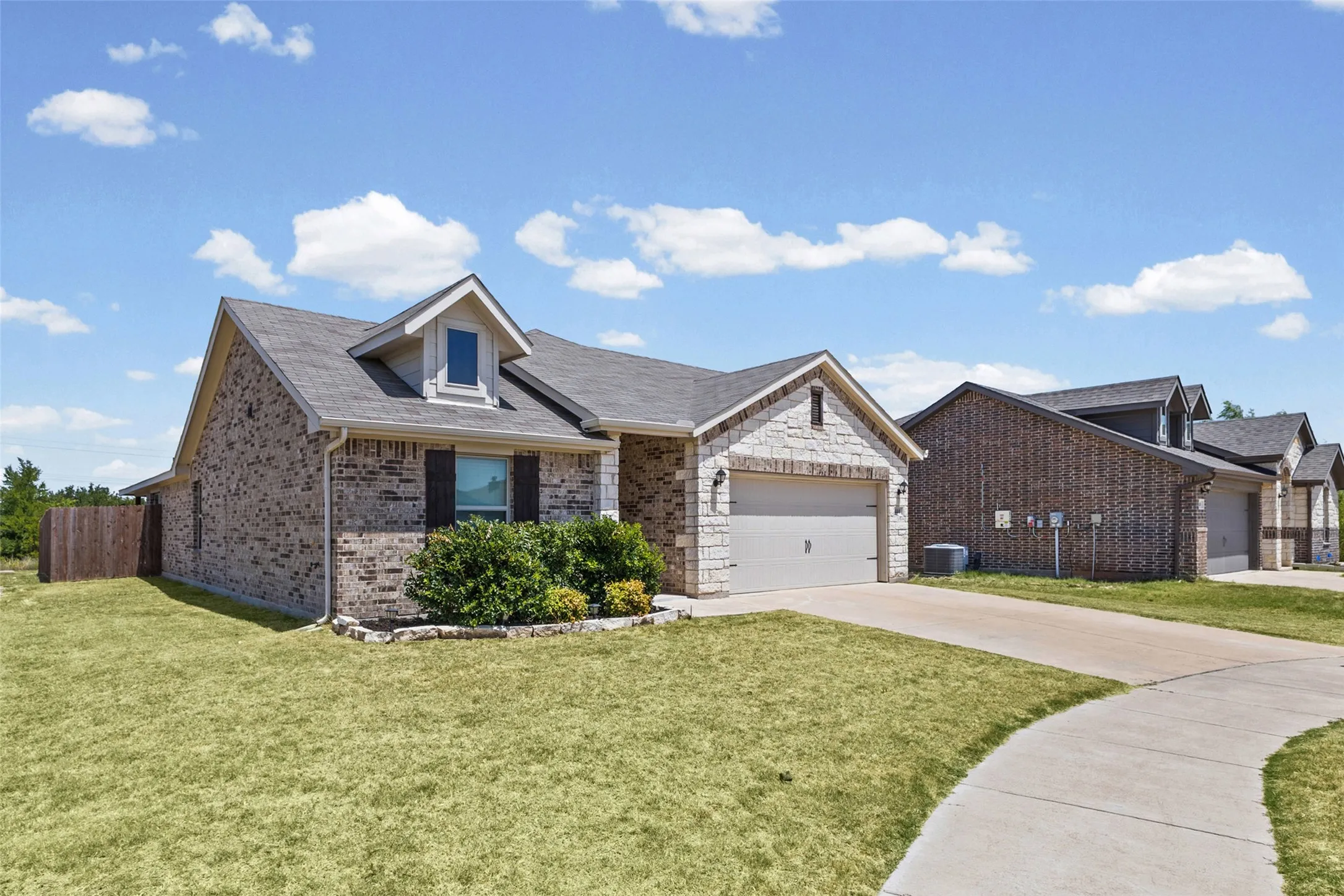 Large lot with green space next door.