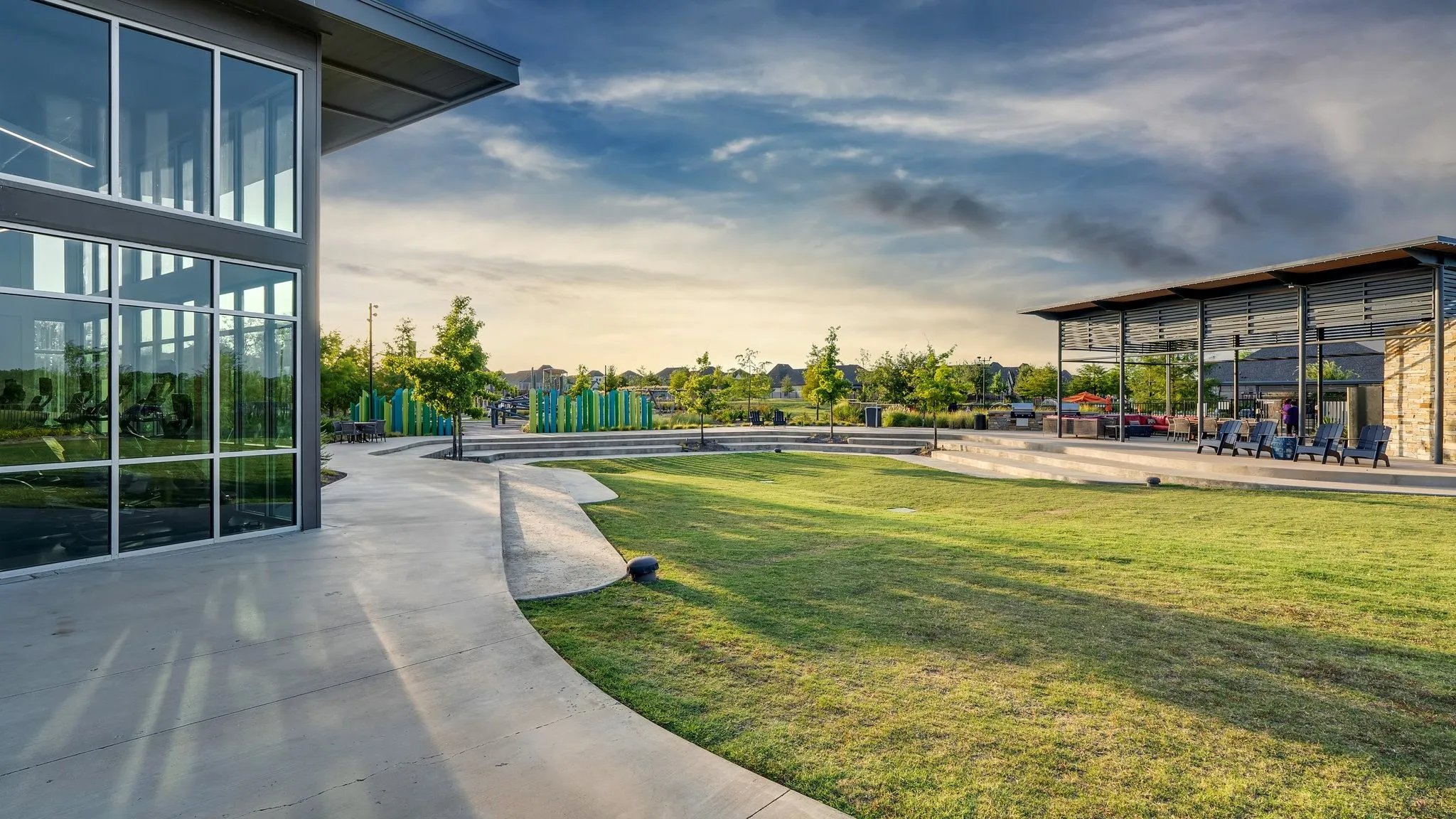 Trinity Falls amenity center with resort-style pool and open lawn.