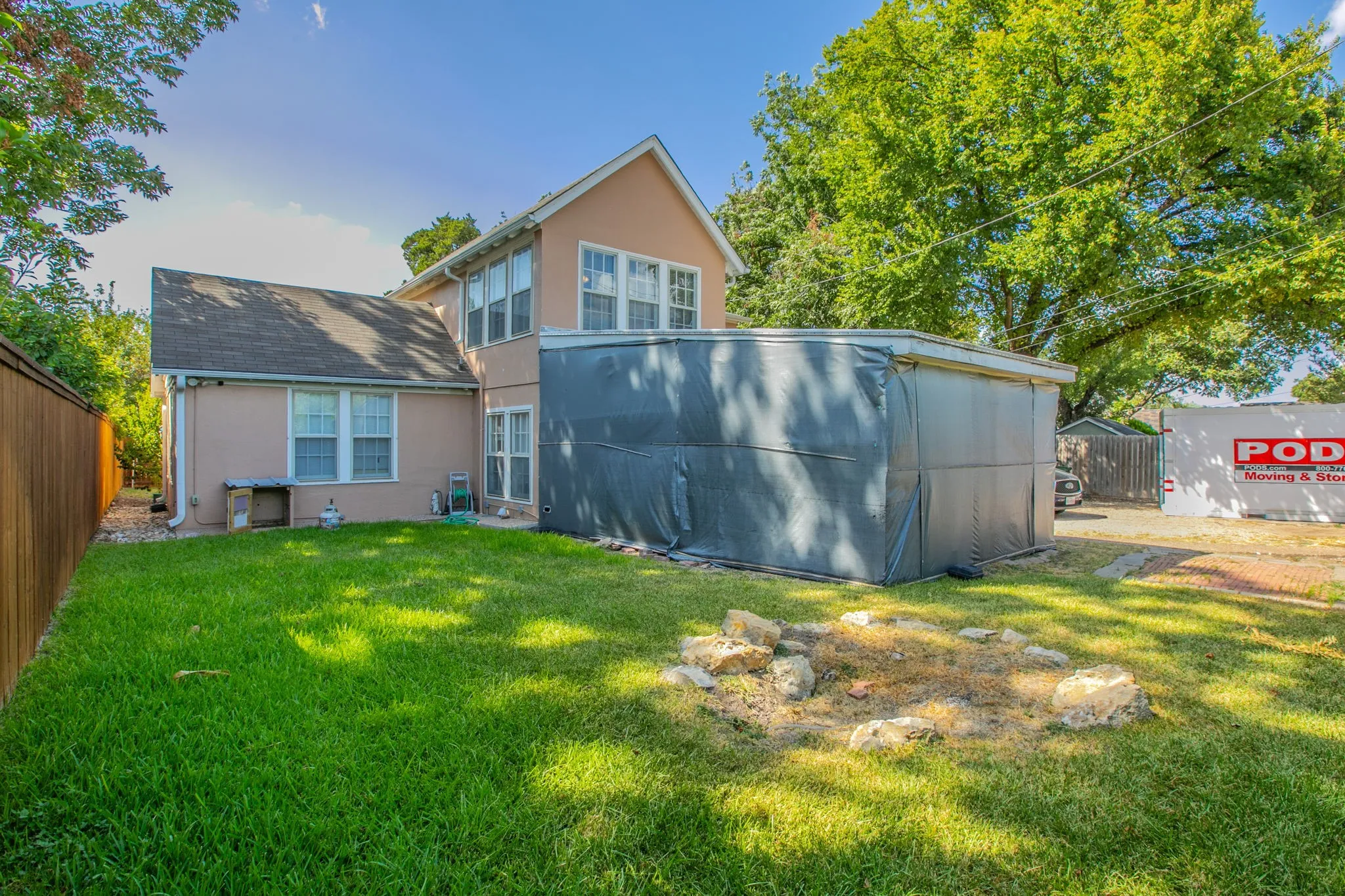 Manicured lawn with a privacy fence