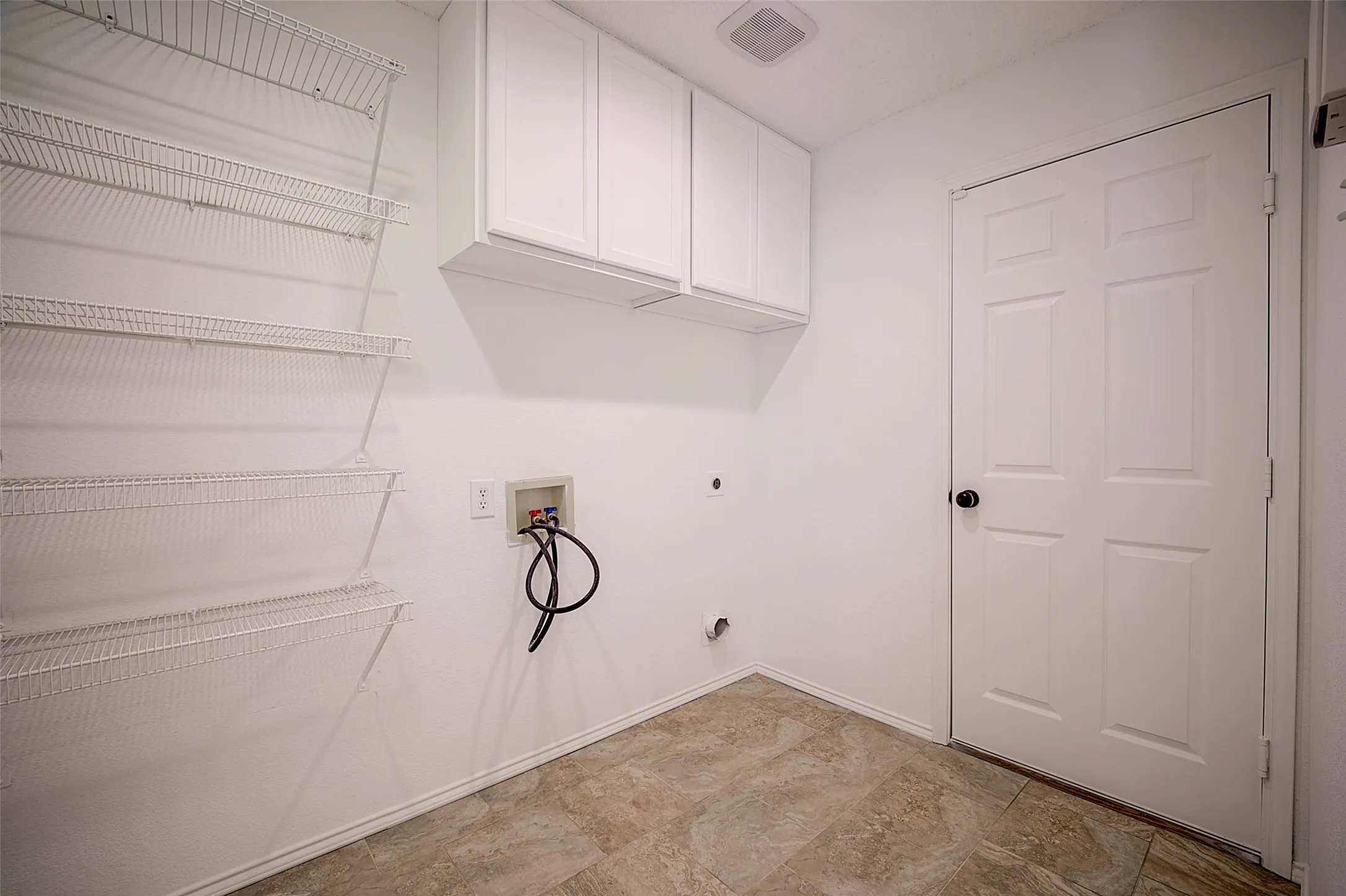 White cabinetry with integrated storage