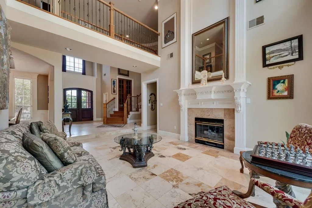 Grand foyer with a double-door entry and transom window
