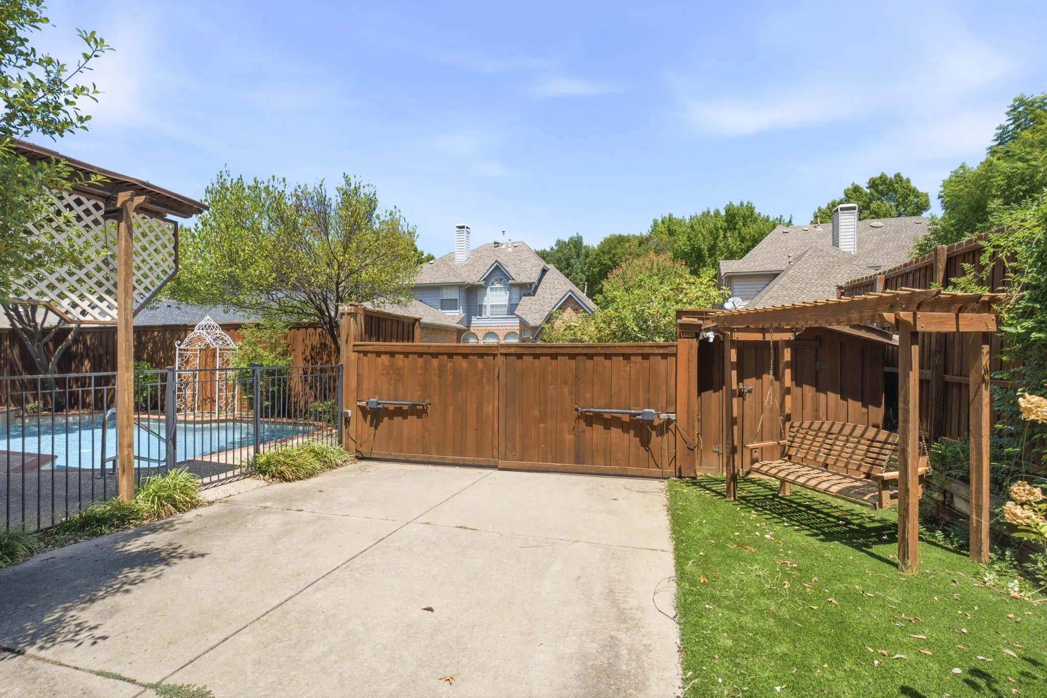 Alley access, electric gate, fenced pool.