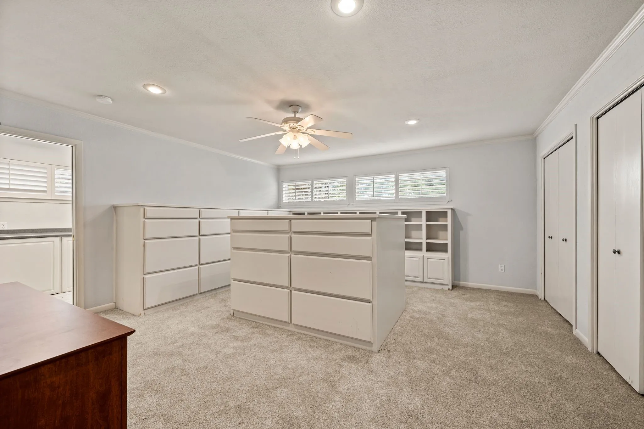 Primary Closet with abundant built-ins.