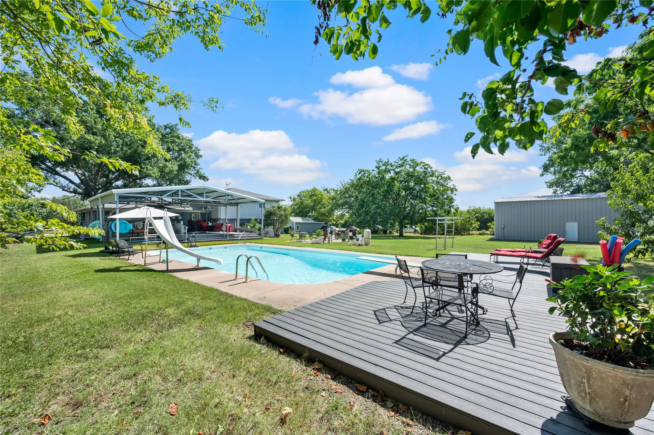 Additional entertaining area at the end of the pool.