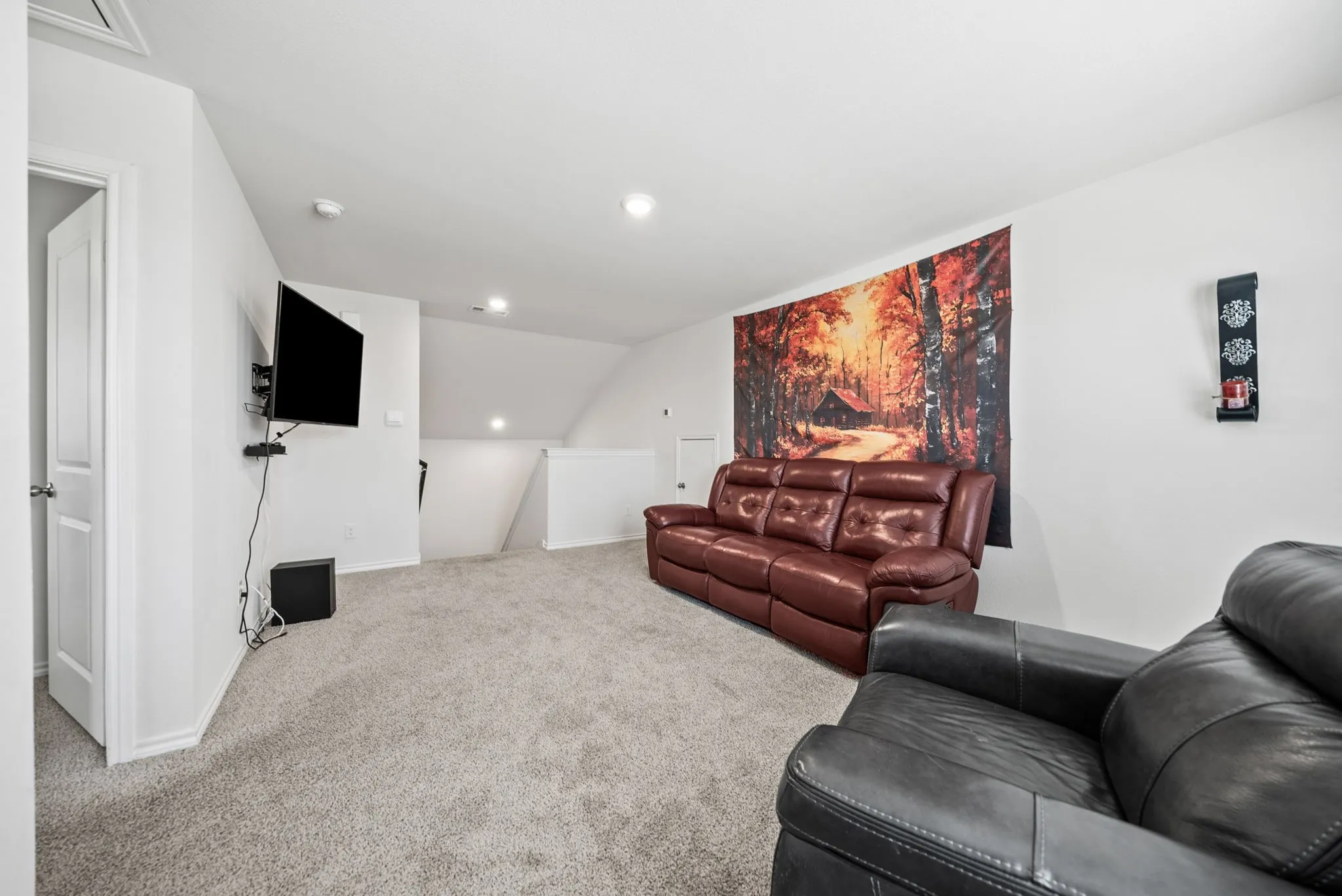 Carpeted flooring, recessed lighting, and an architectural ceiling detail
