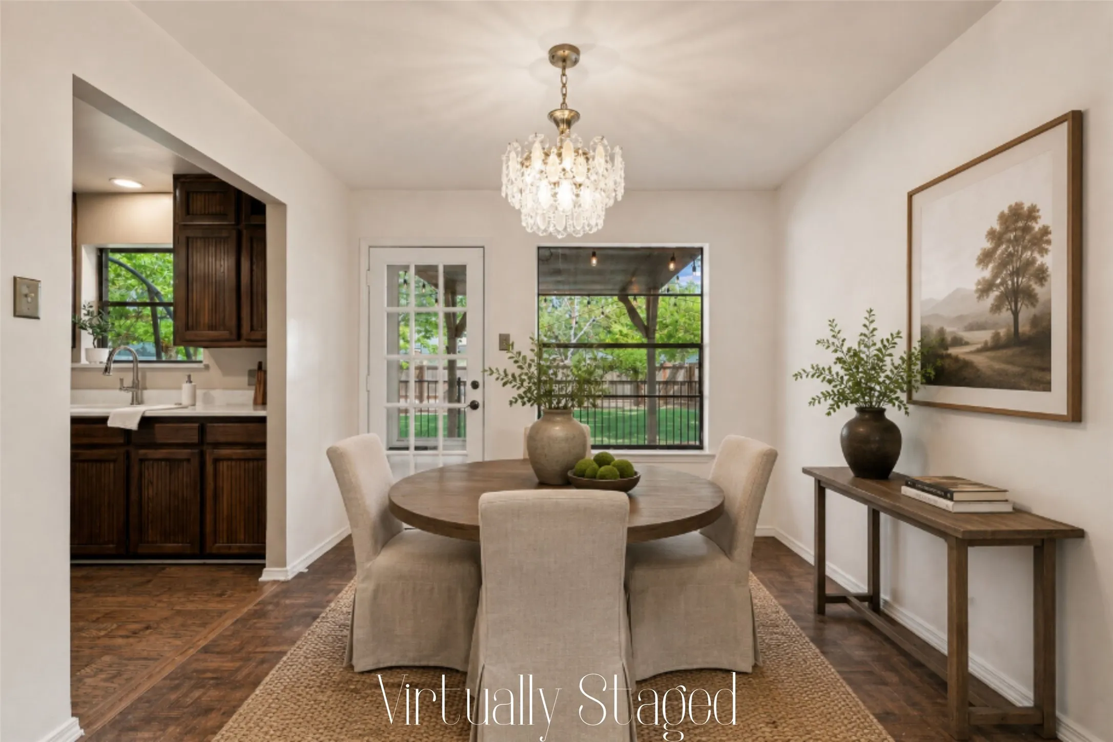 The dining room features parquet floors, a beautiful chandelier, and easy access to the kitchen and back yard.