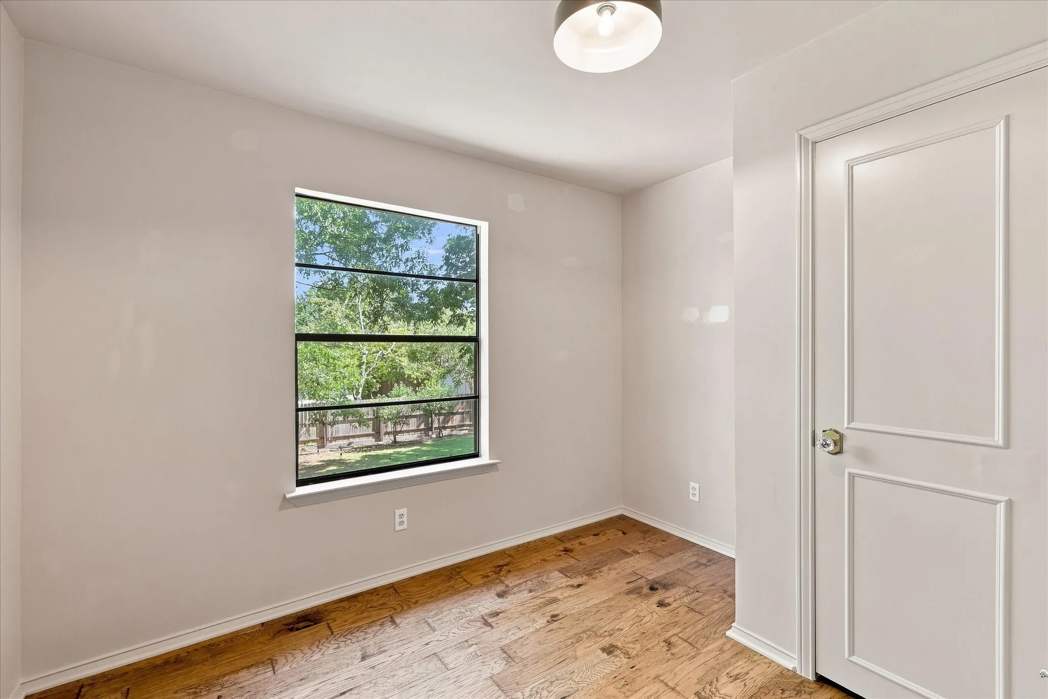 Second-story bedroom overlooks the expansive back yard.