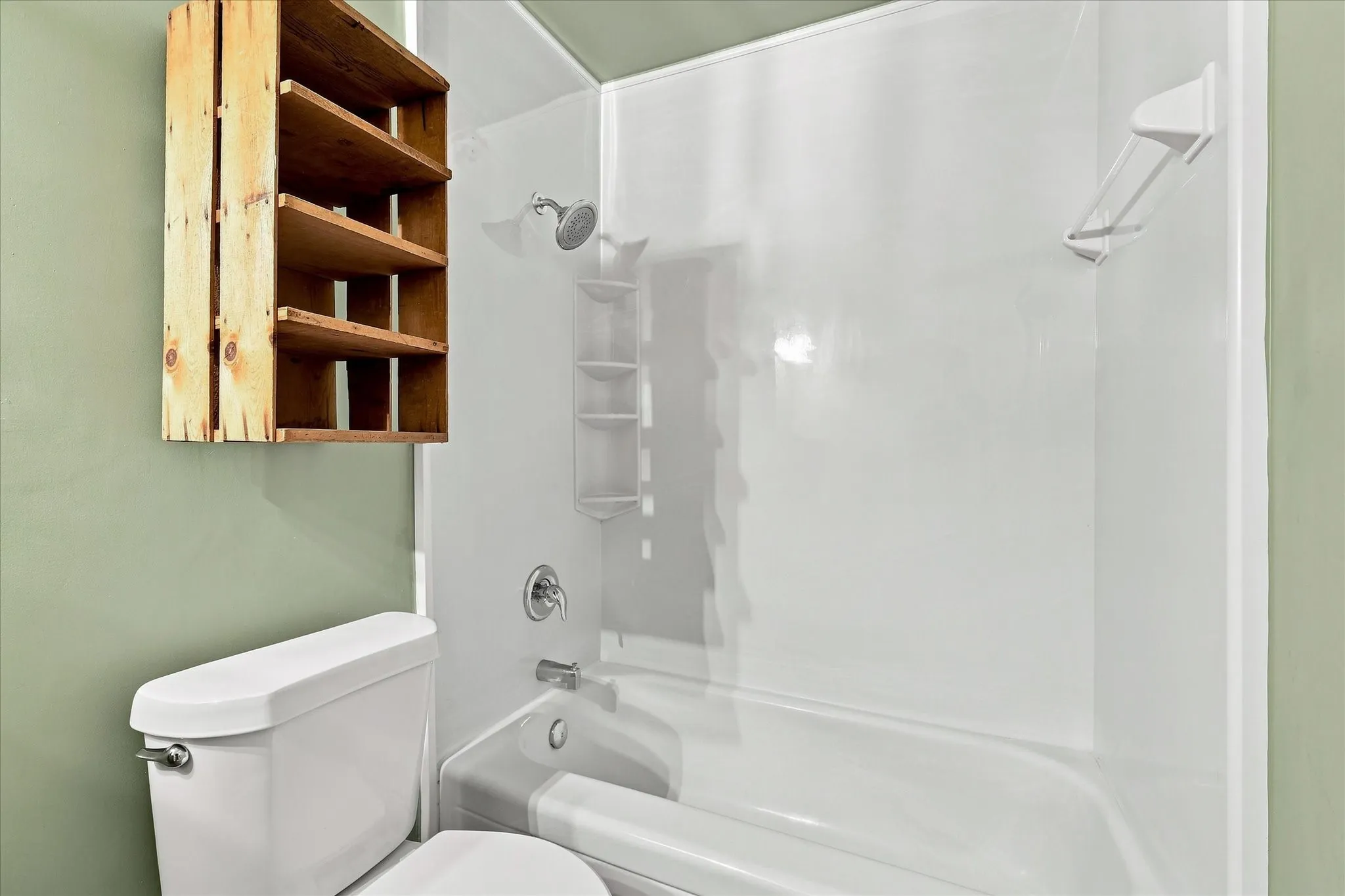 Primary ensuite bath features vintage cabinet and recently installed tile.