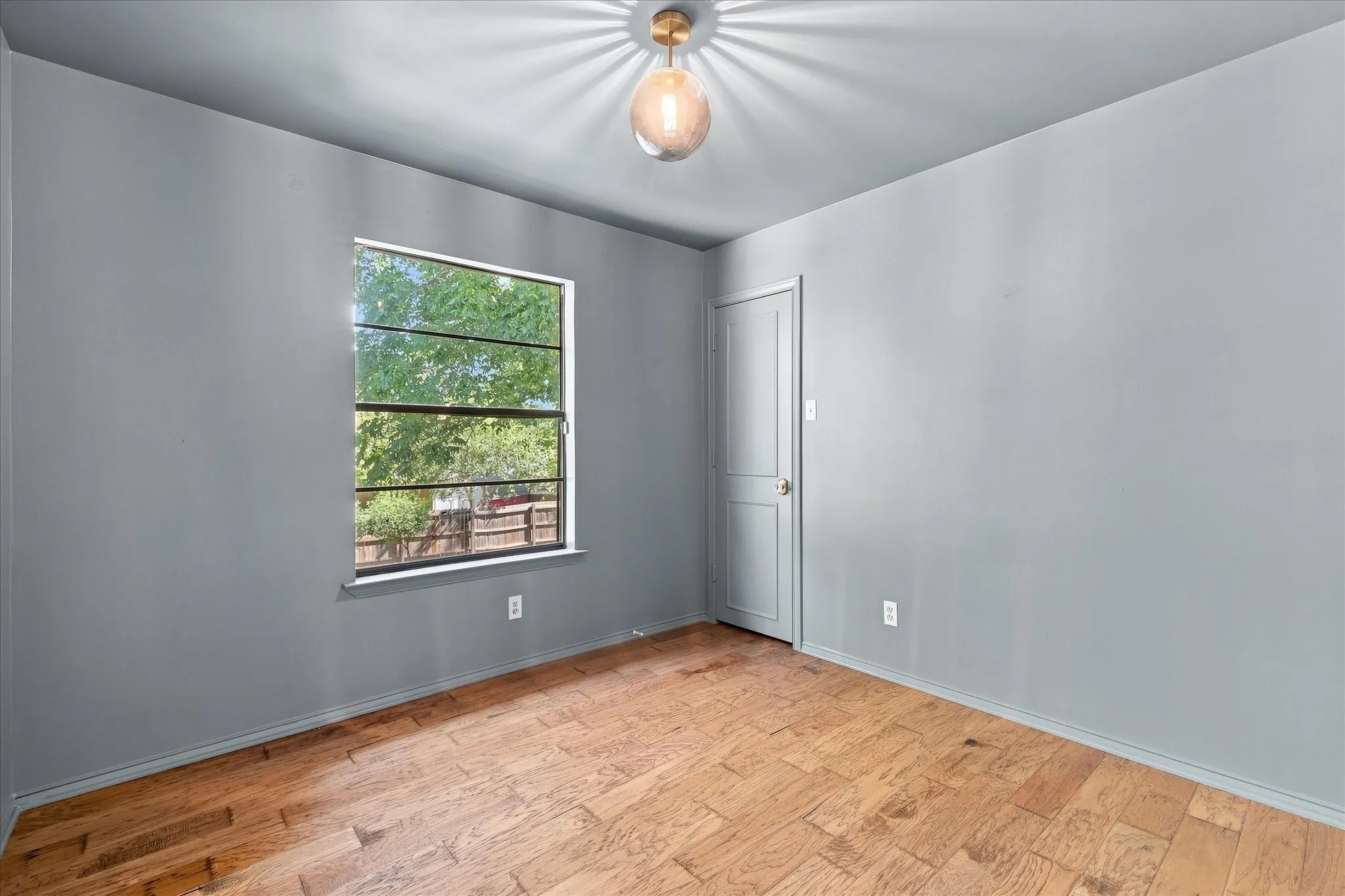Second-story bedroom overlooks the expansive back yard.