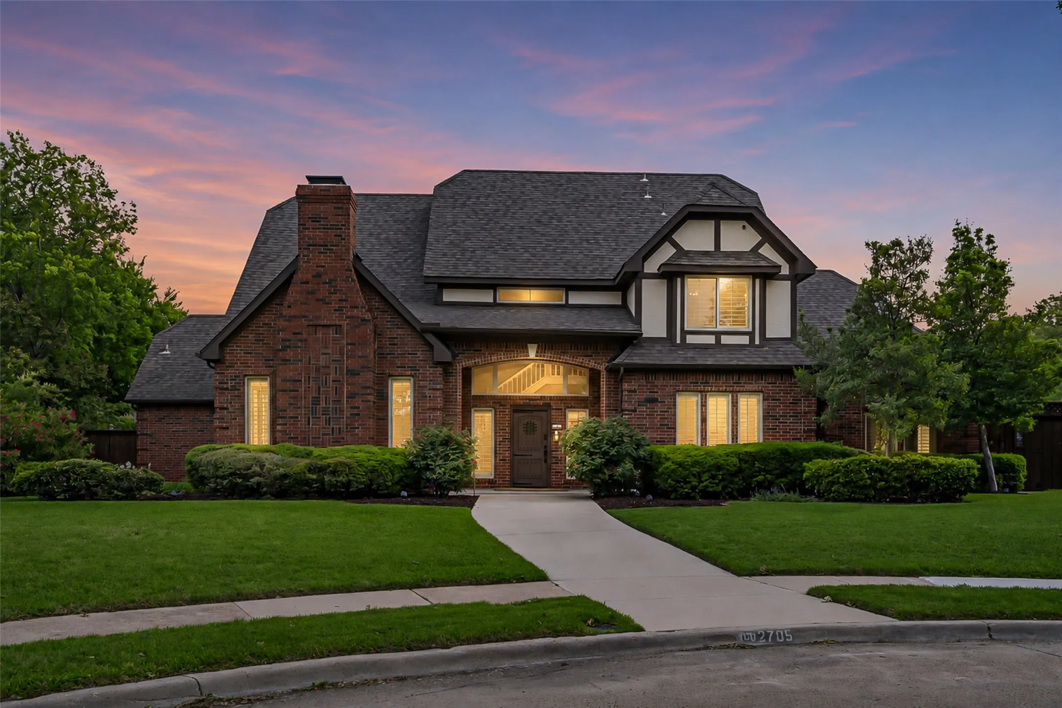 Brick exterior with white and dark trim accents