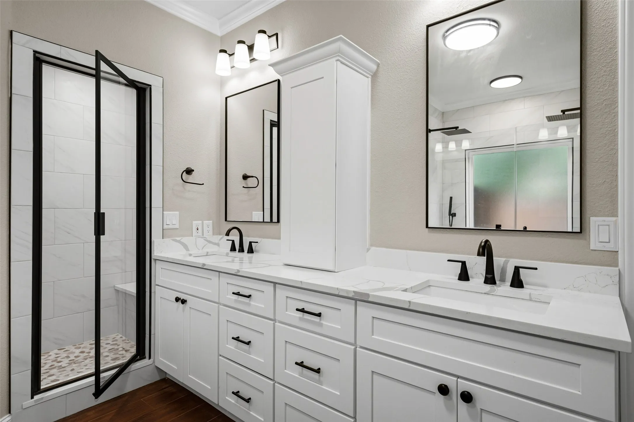 Dual vanity with white cabinetry and integrated sinks