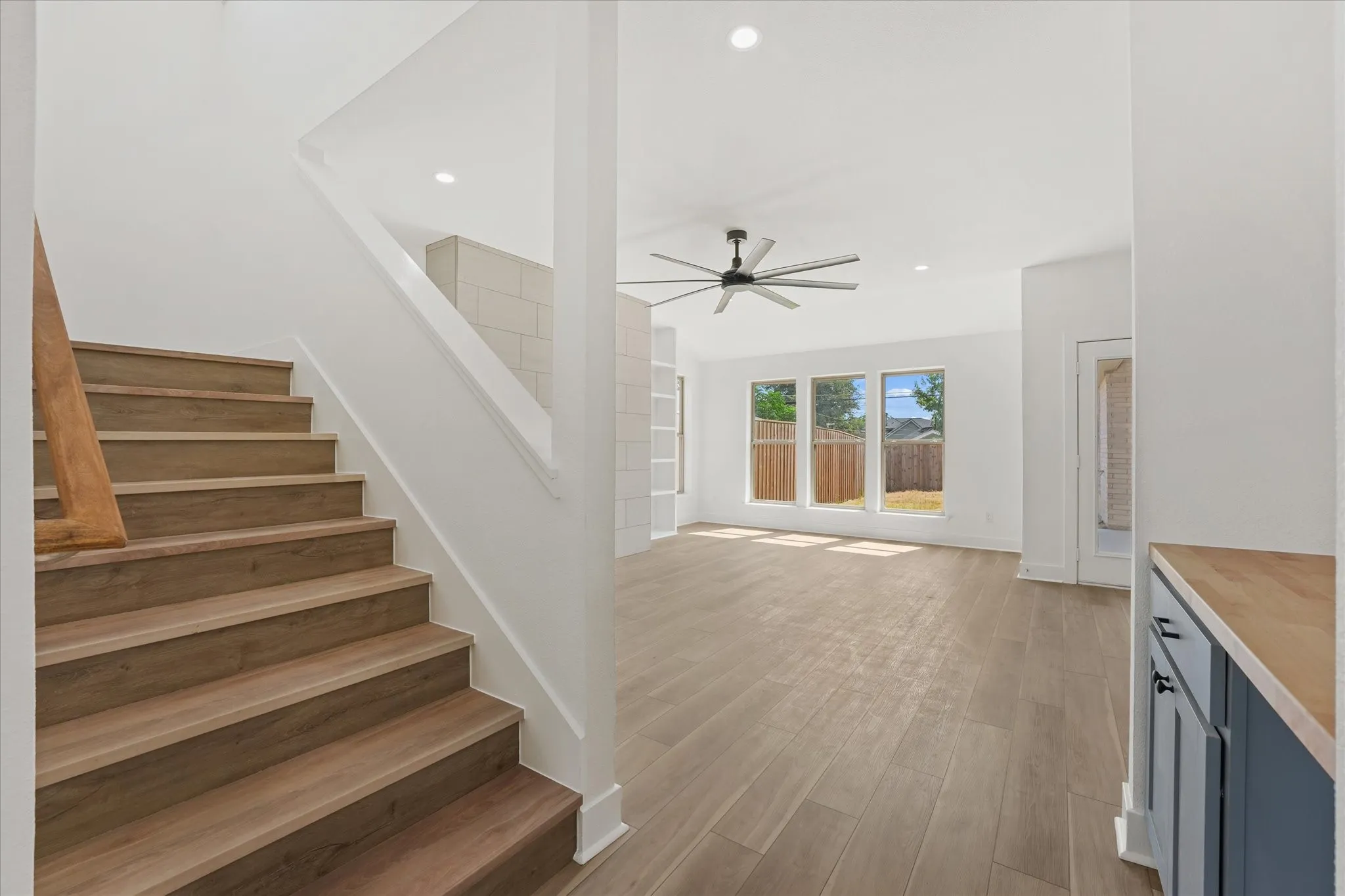 Wood-finish stairs with a wood handrail