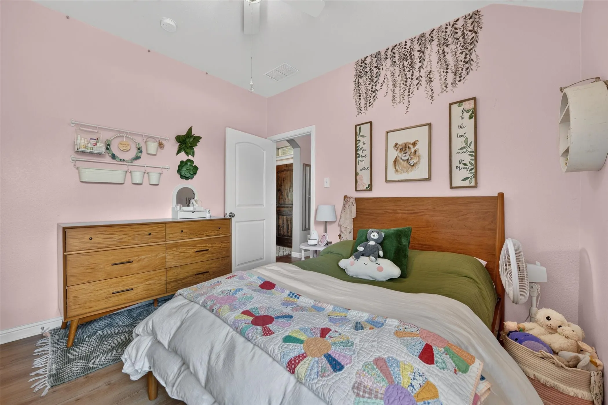 Vaulted ceiling, ceiling fan, wood-finish flooring, white trim, recessed lighting