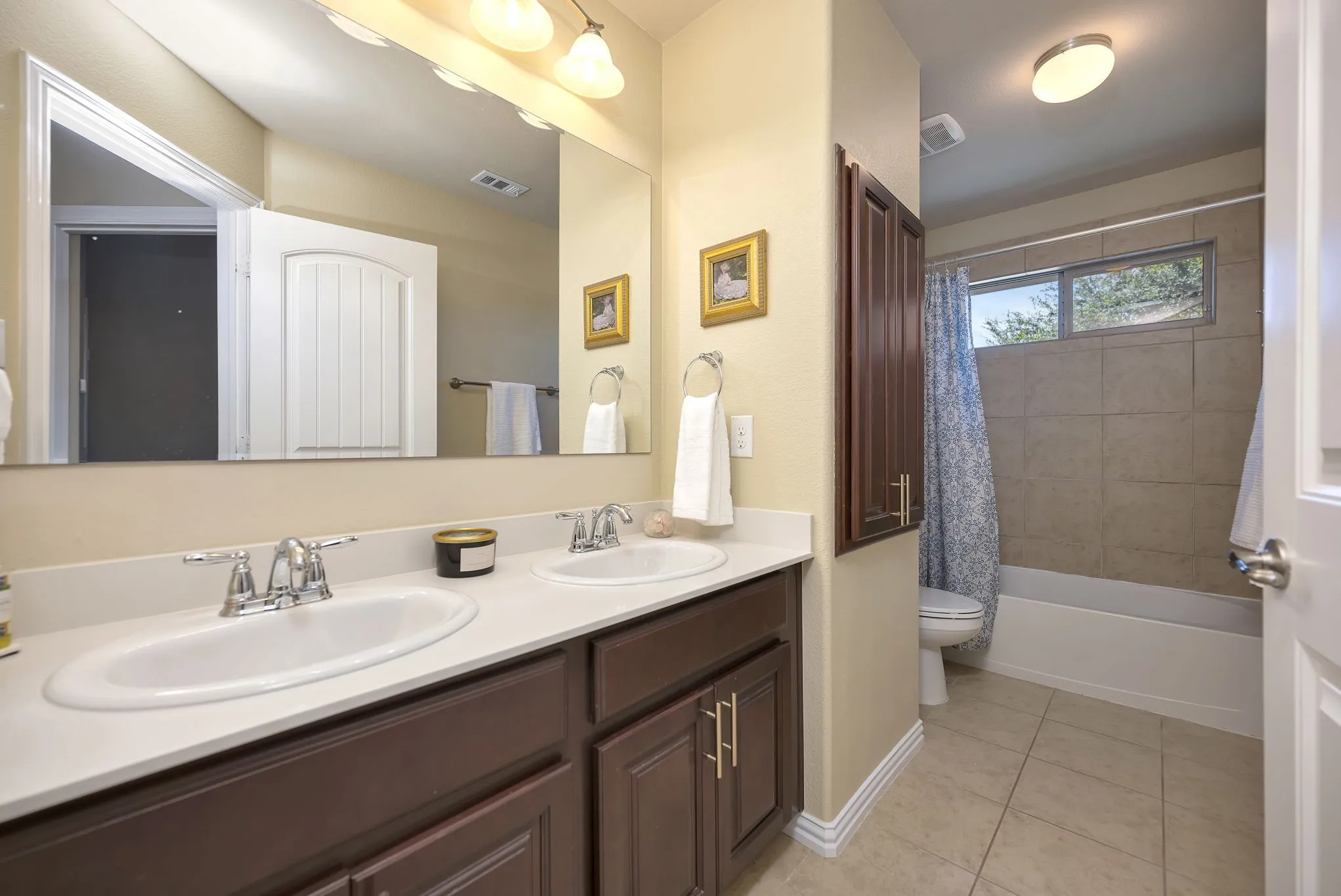 Full bathroom in hallway upstairs.