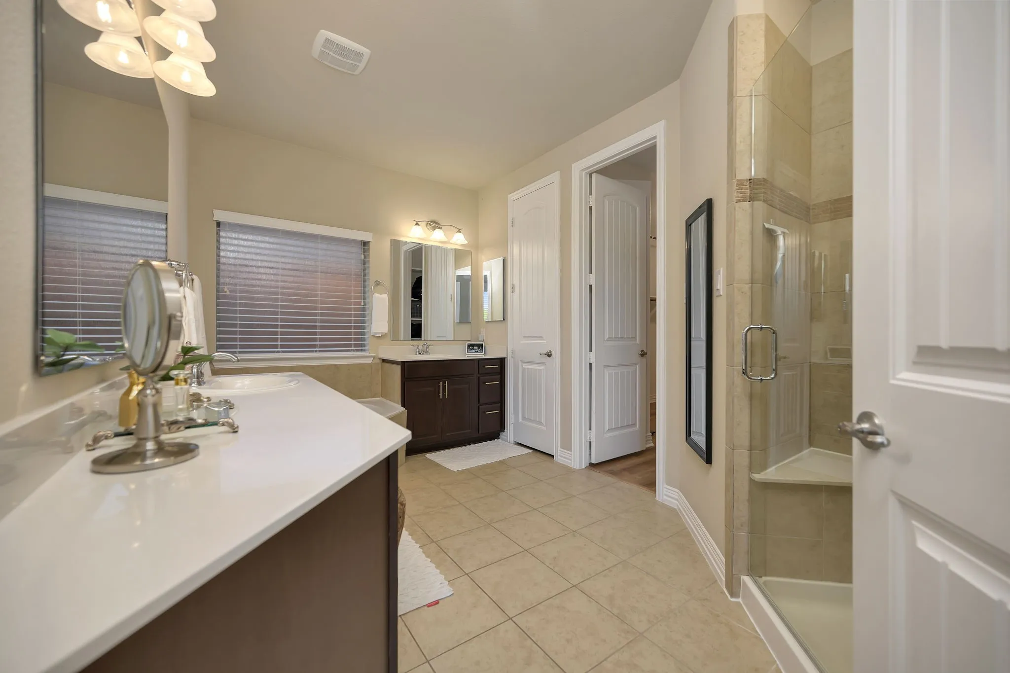 Separate vanities in the primary bathroom.