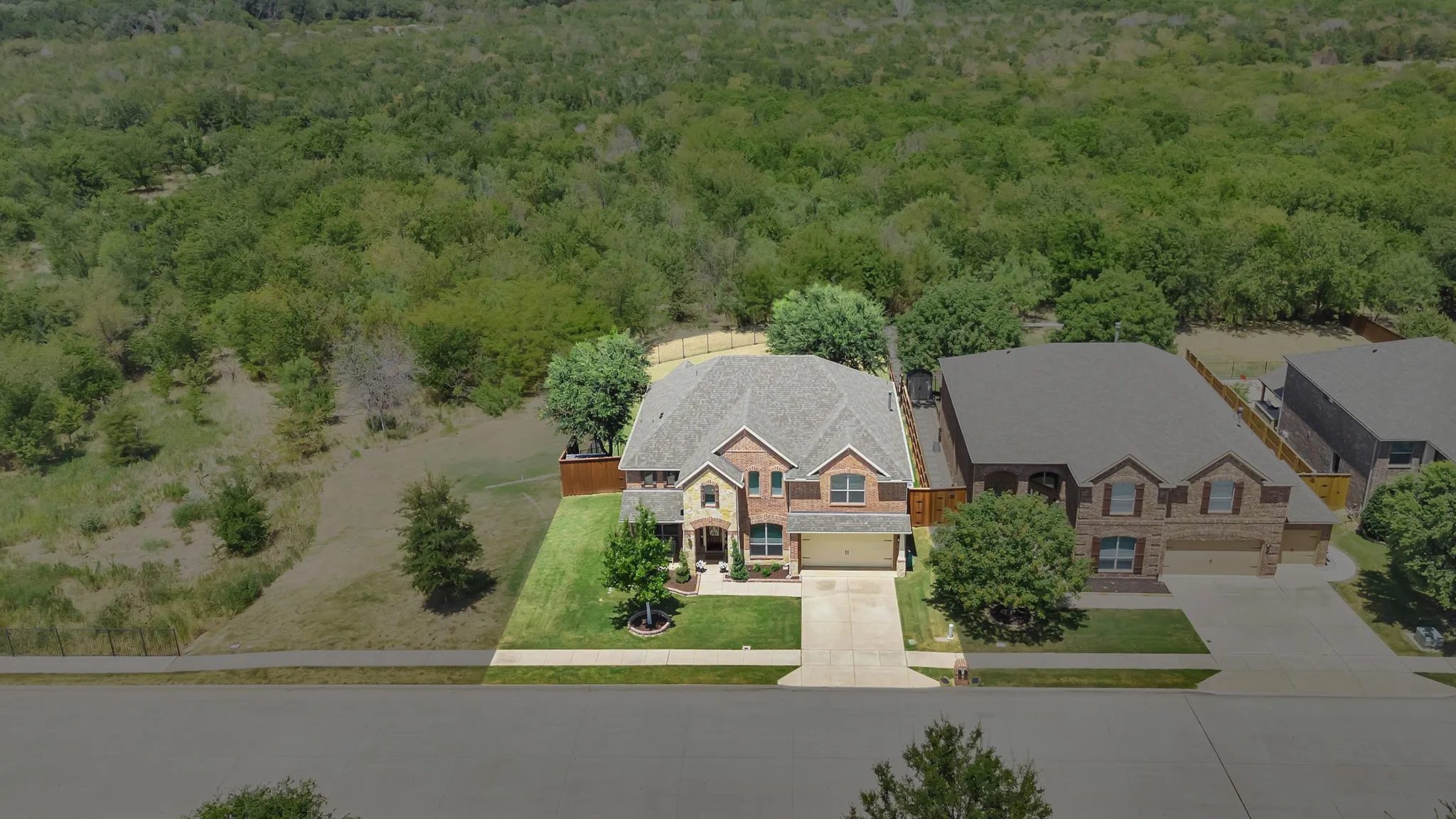Private with woods behind and greenbelt beside the home.