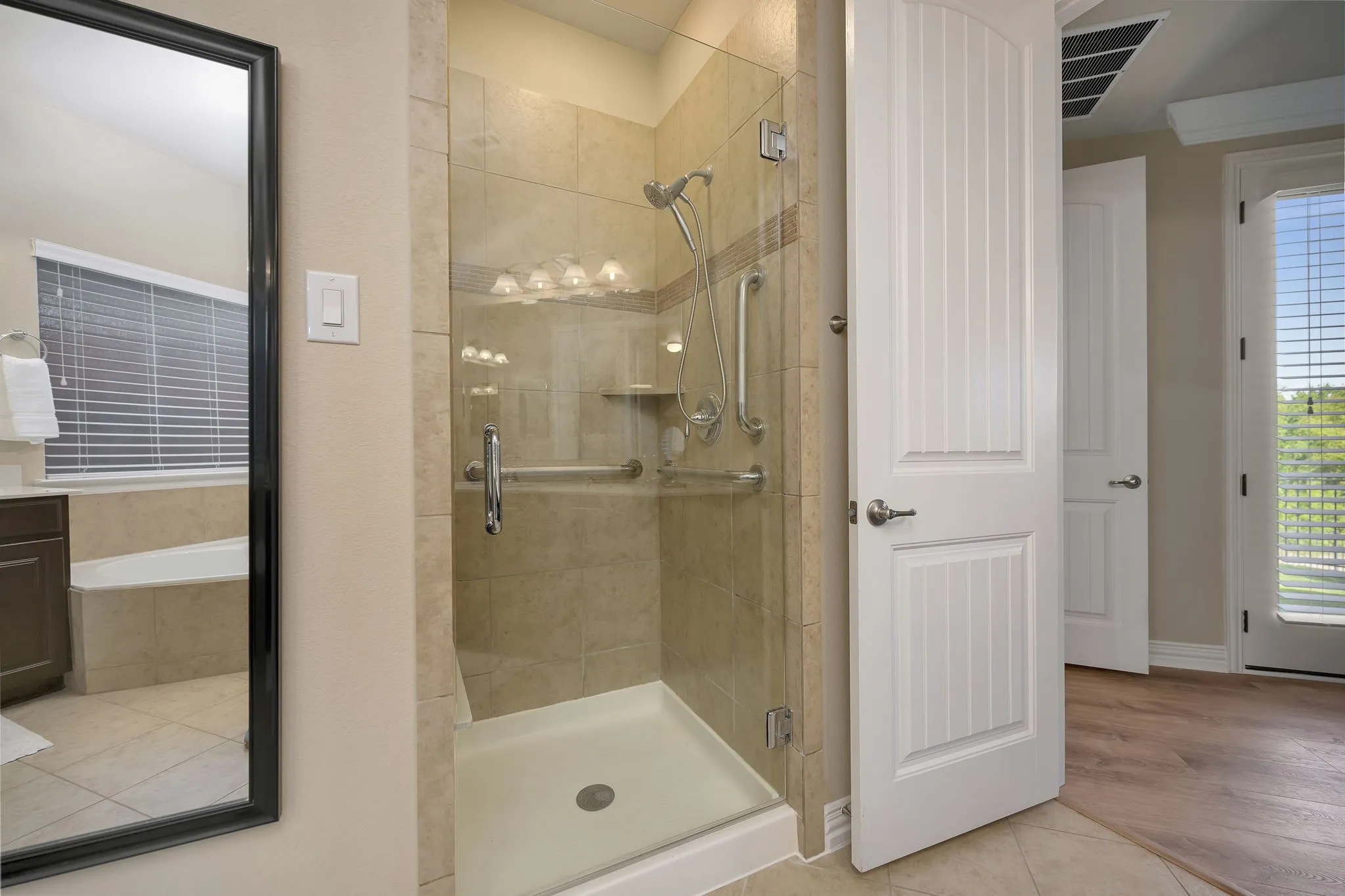 New frameless shower door in the primary bathroom.