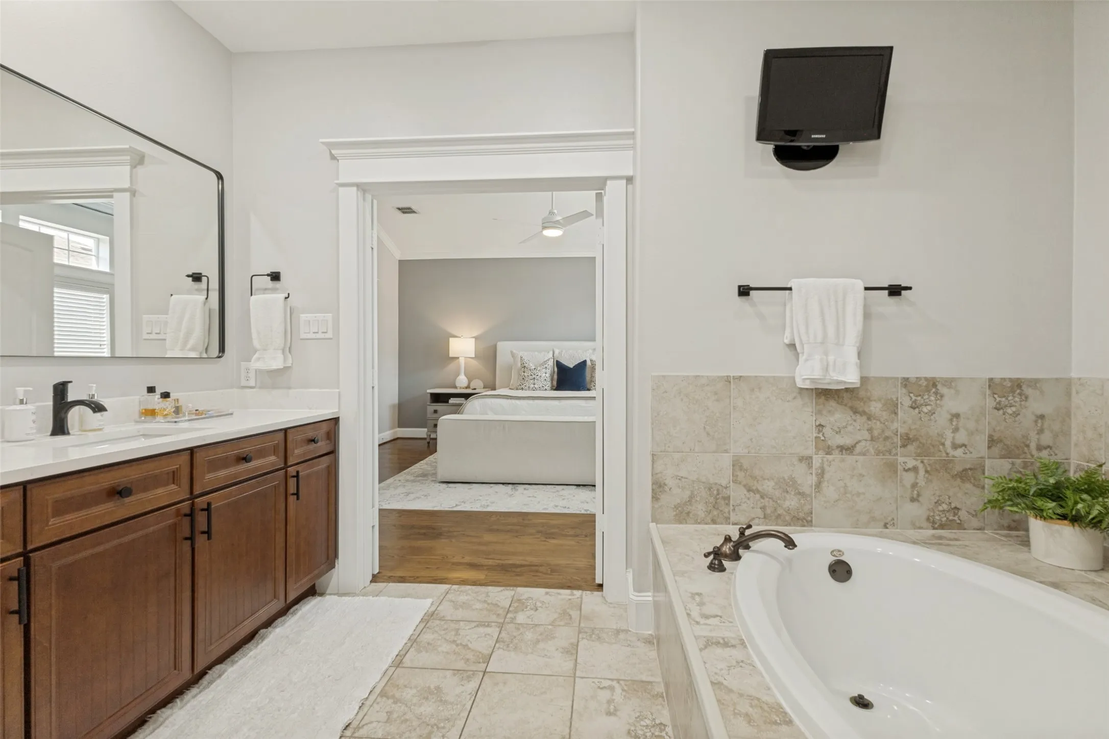 Updated primary bathroom with quartz countertops