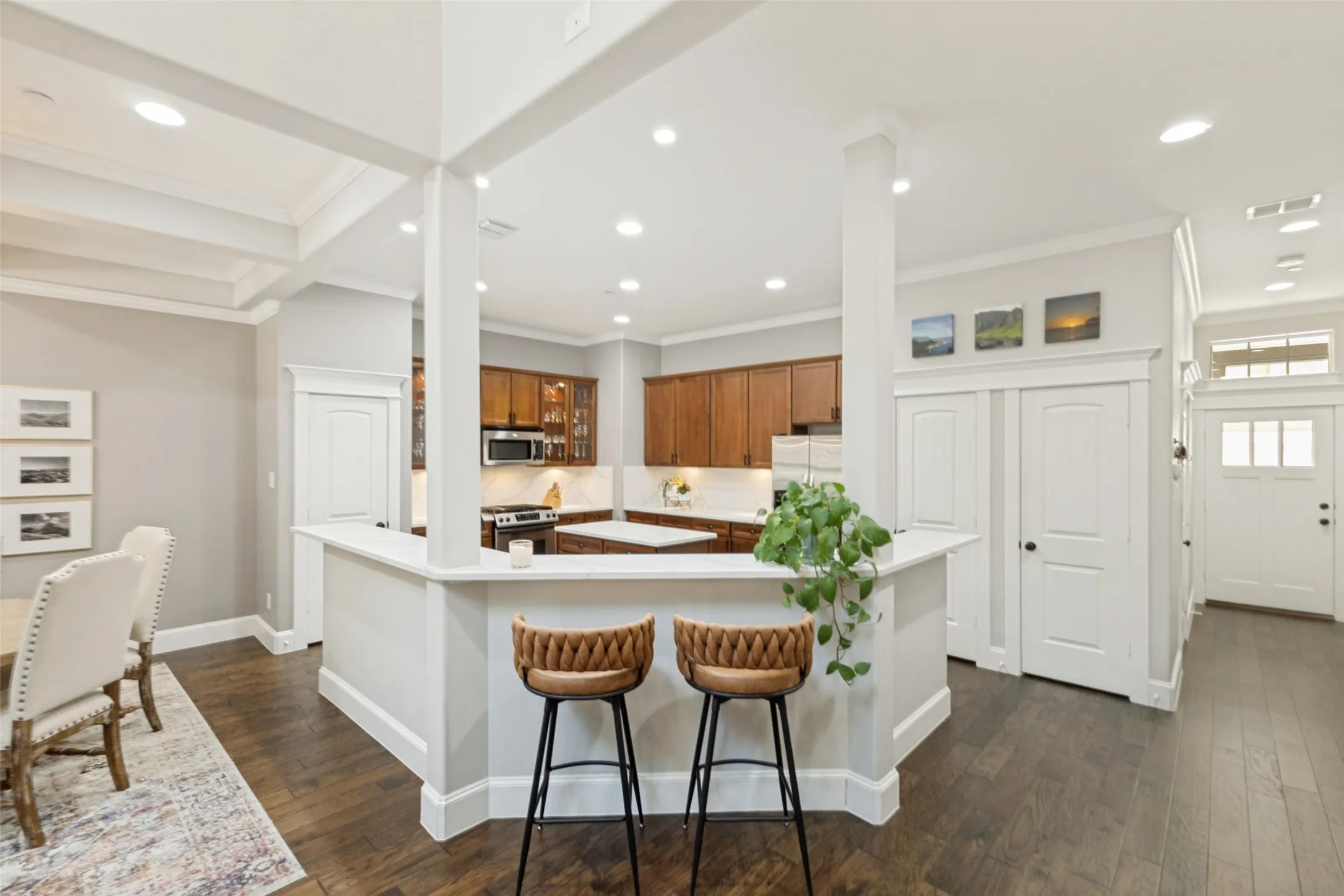 Kitchen with quartz countertops and floor to ceiling cabinetry