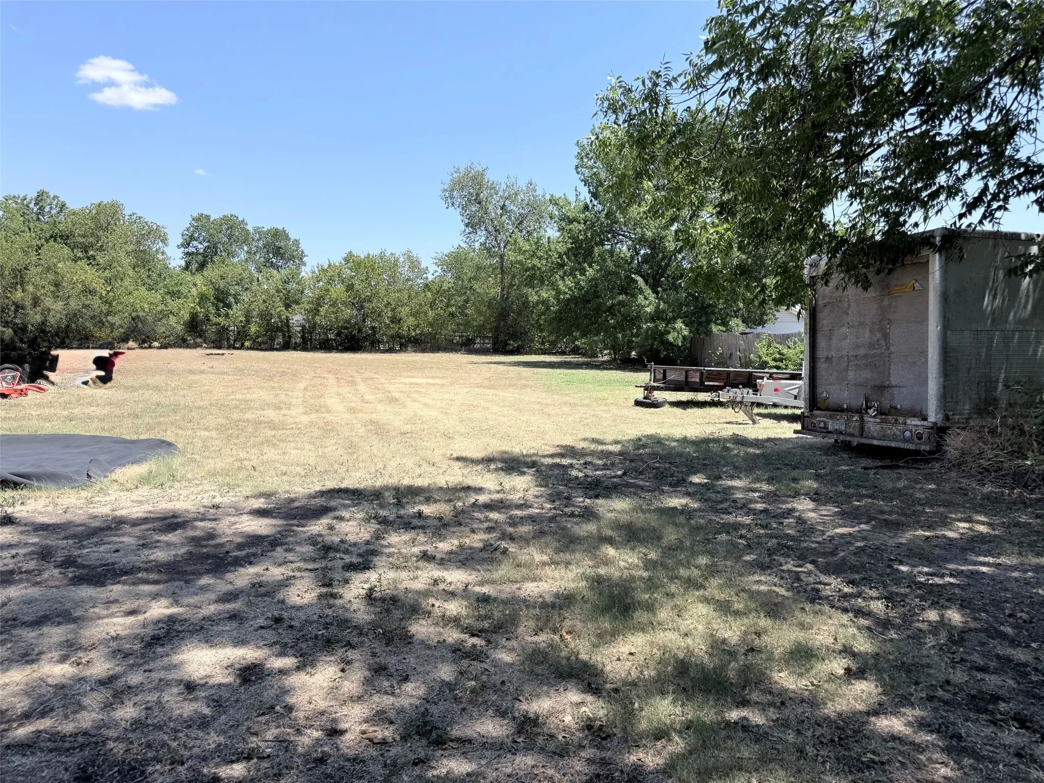 Expansive open lot with mature perimeter trees