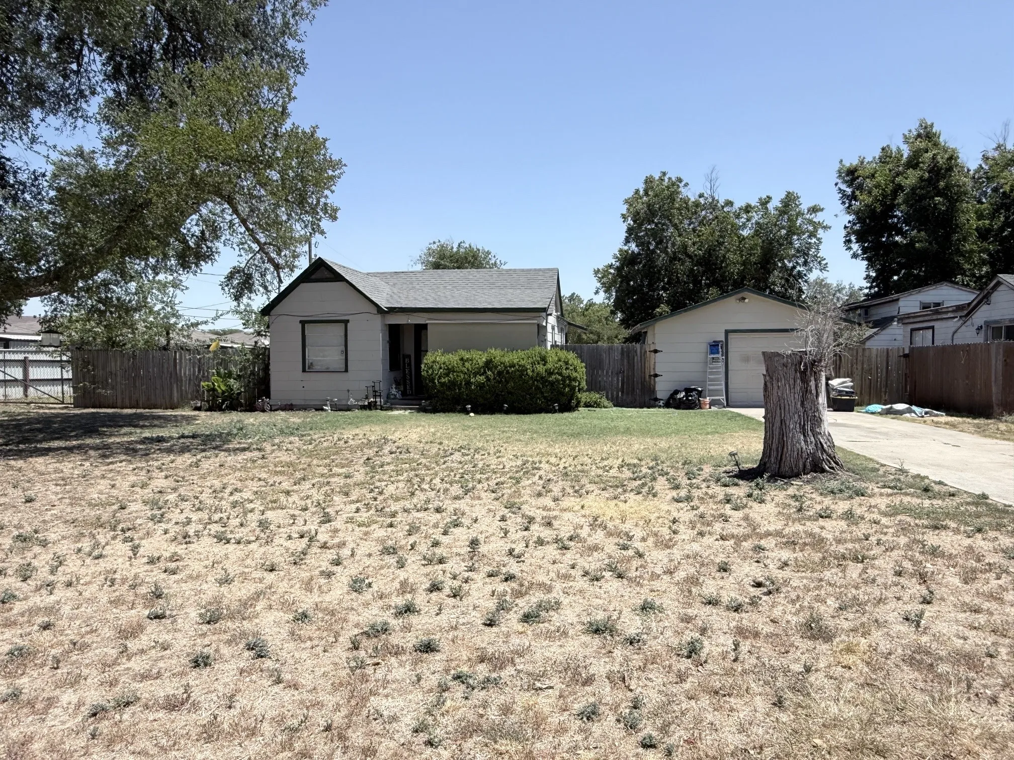316 Ralph Street (2nd dwelling) Single-story residence with a pitched roof, detached garage, and concrete driveway