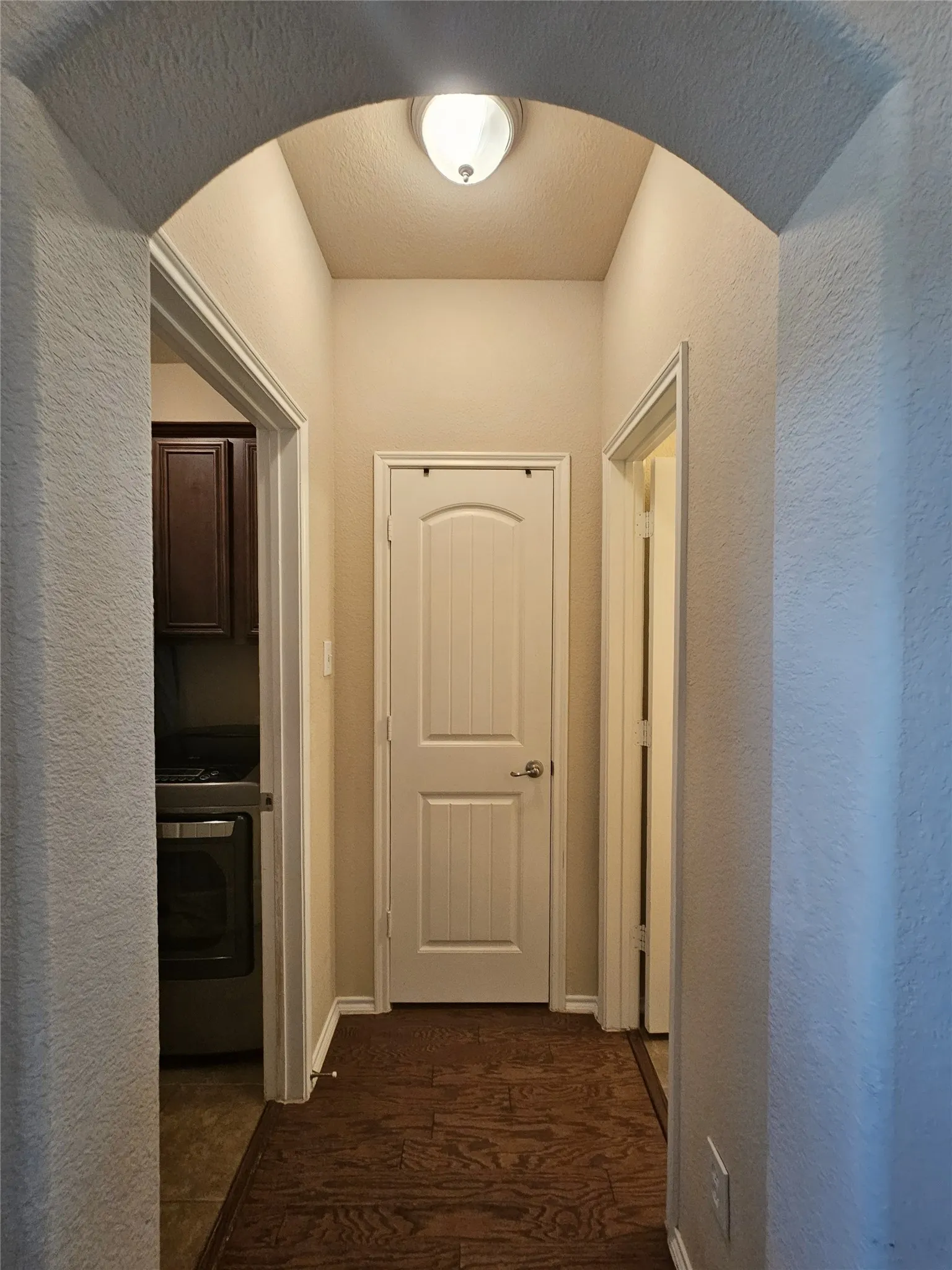 Hallway to 1/2 bath and laundry room