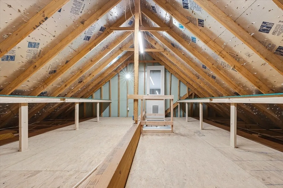 Attic storage space with shelves & lighting