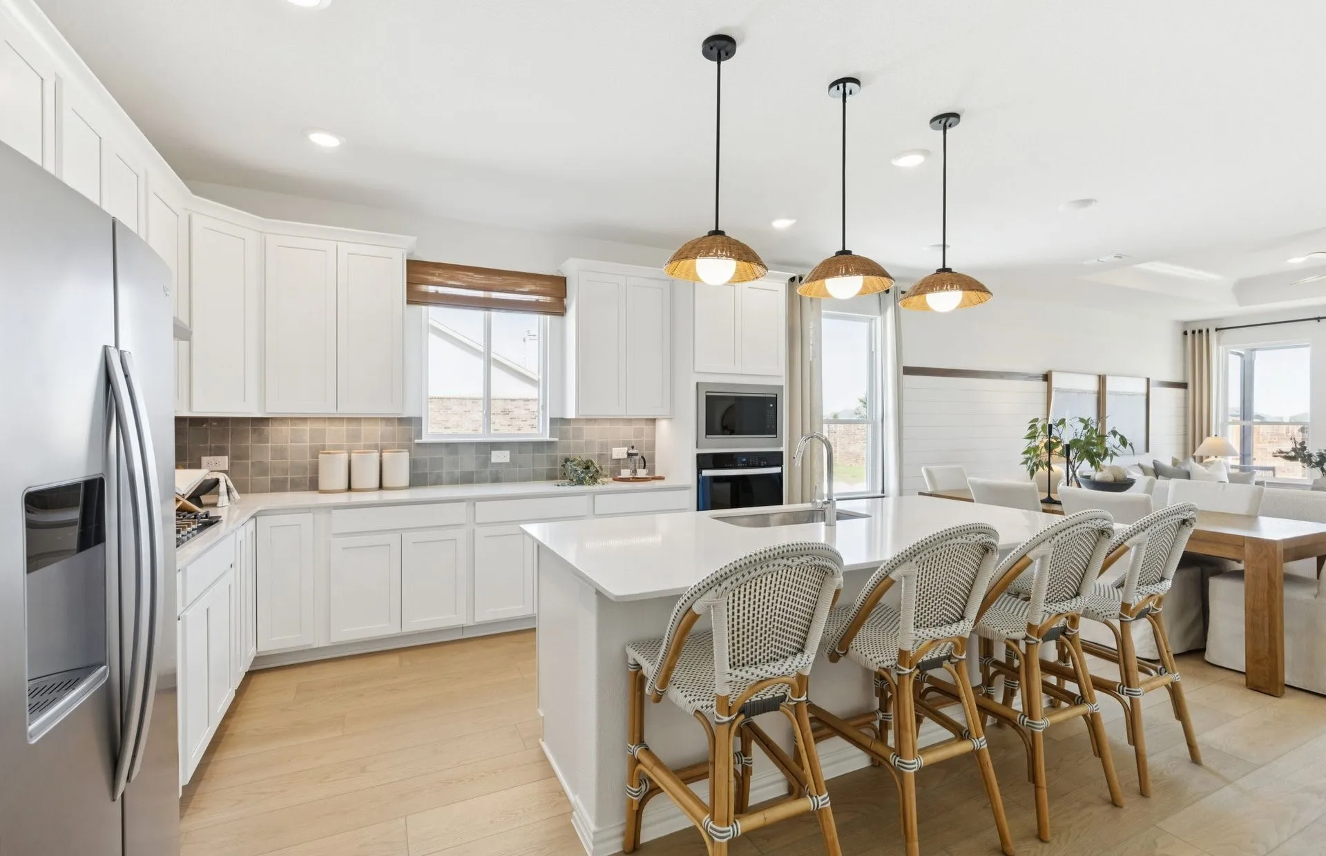 *Model Representation - Large island overlooking gathering room and dining areas