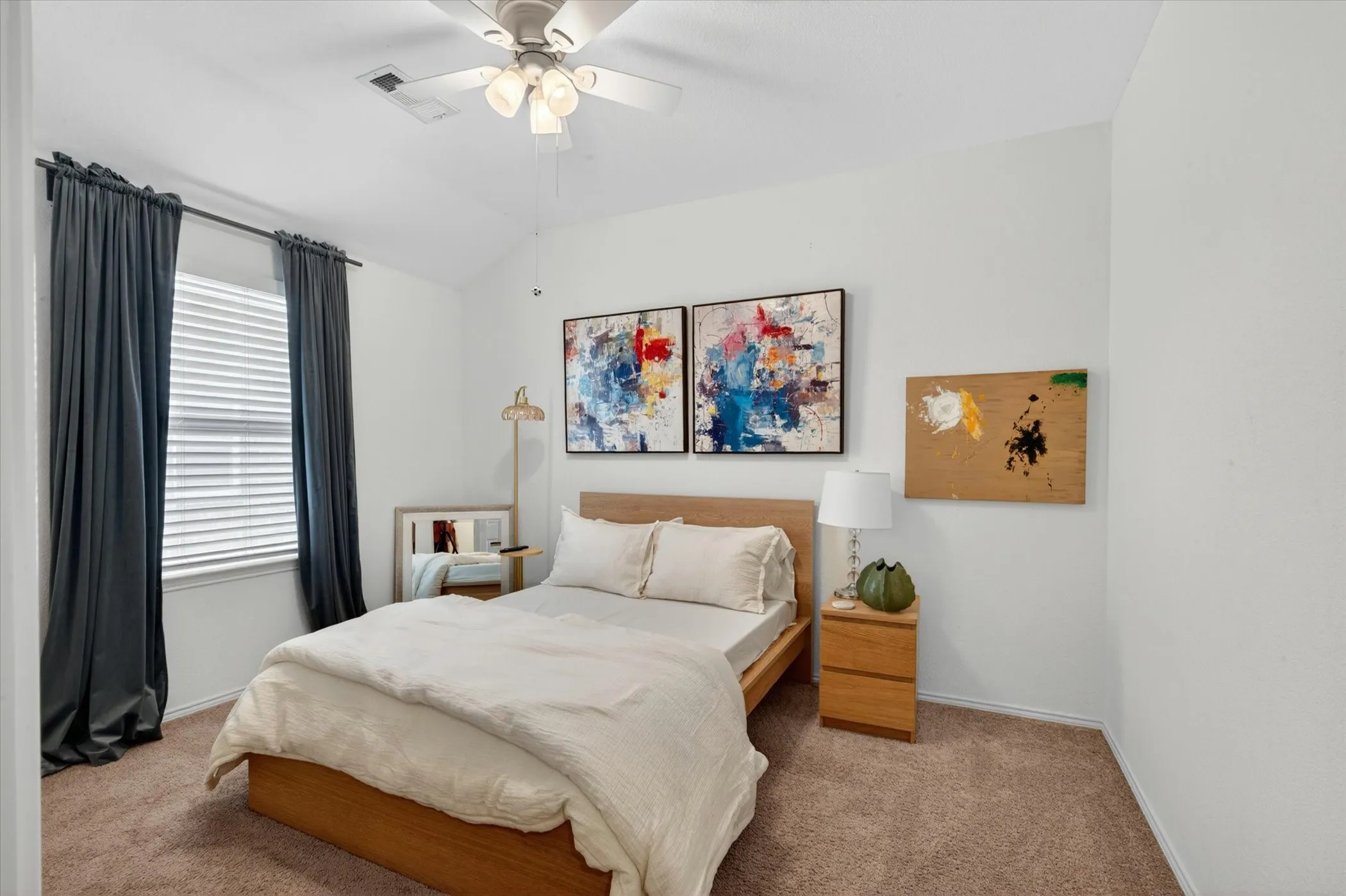 Bedroom featuring a vaulted ceiling with a ceiling fan, a window with blinds, and brown carpet flooring