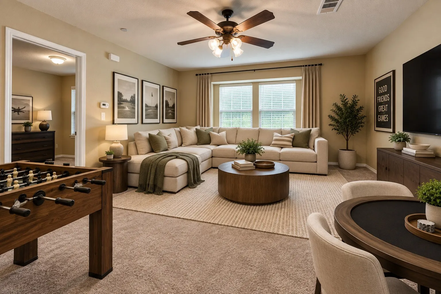 Carpeted flooring throughout, recessed ceiling lighting, a ceiling fan with integrated lighting, and multiple windows with blinds