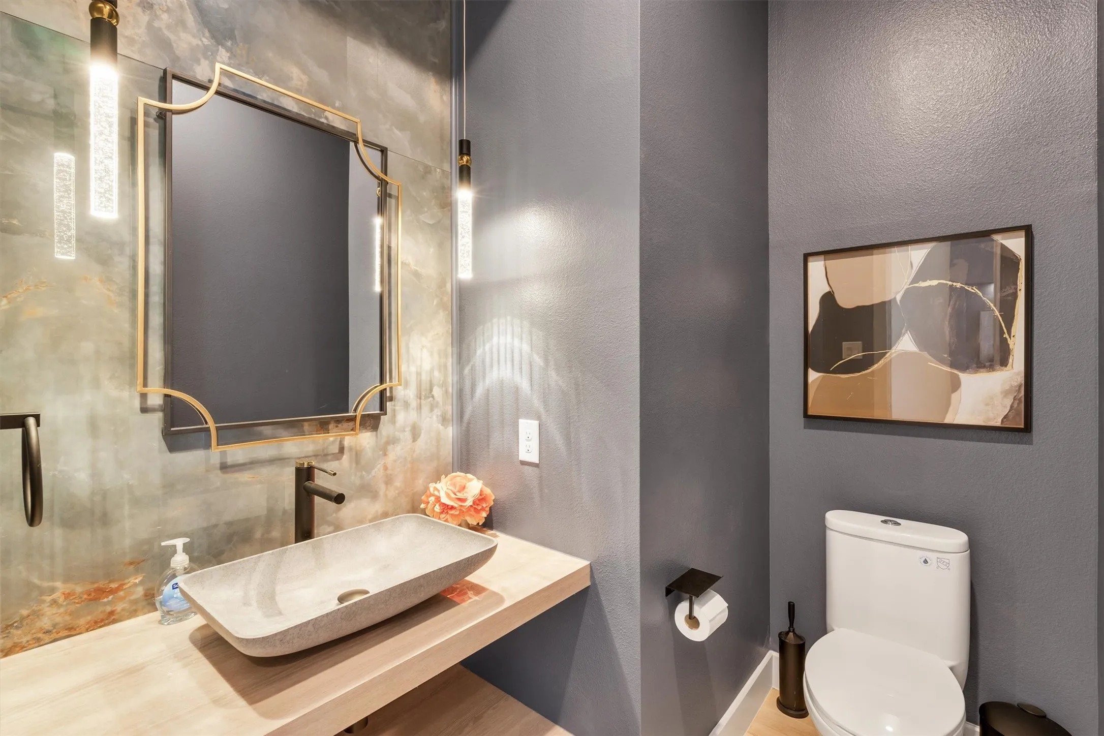 Modern powder room featuring a floating wood-finish vanity with a rectangular vessel sink, light wood countertop, and matte black wall-mounted faucet