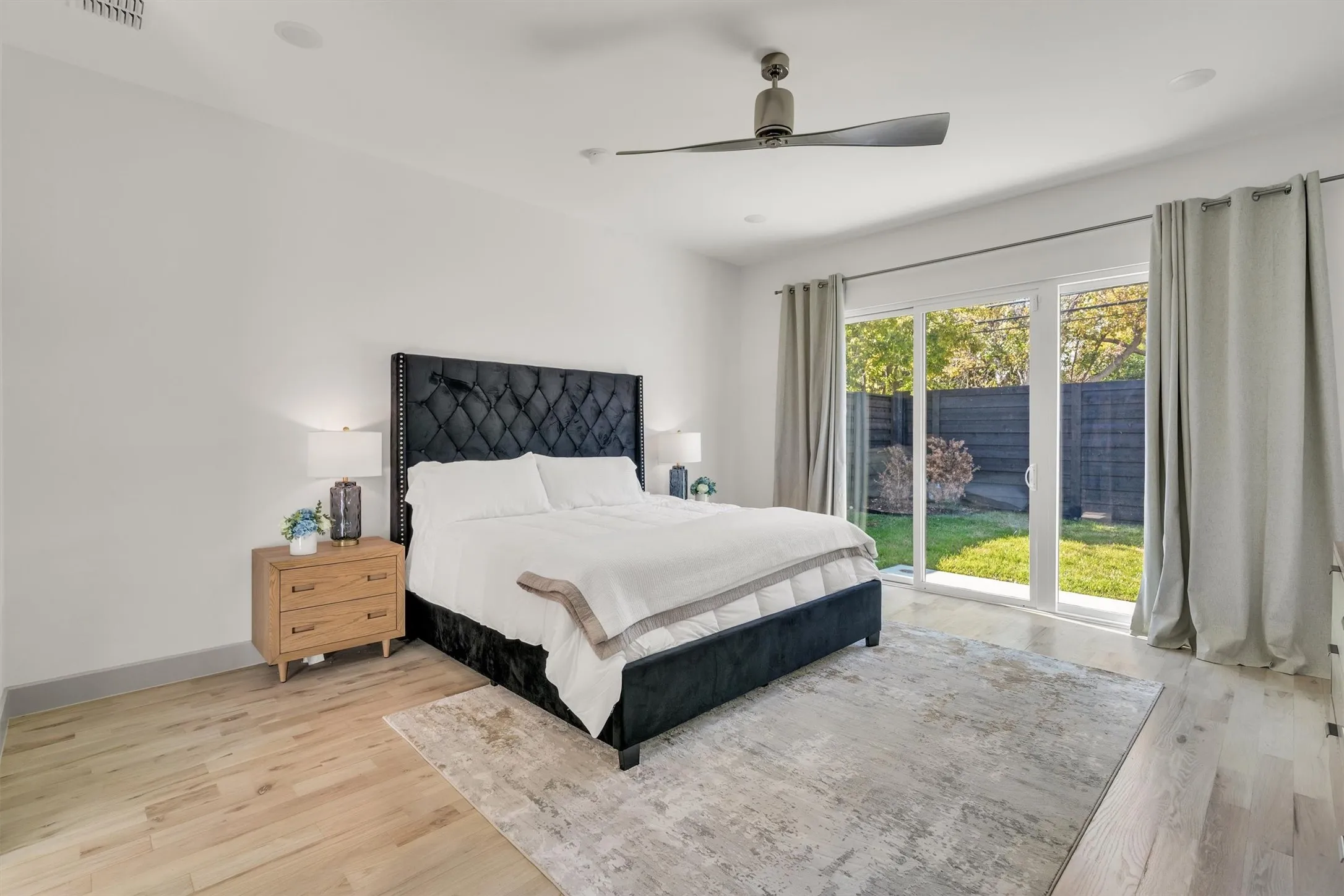 Wood-finish flooring, recessed lighting, and a ceiling fan