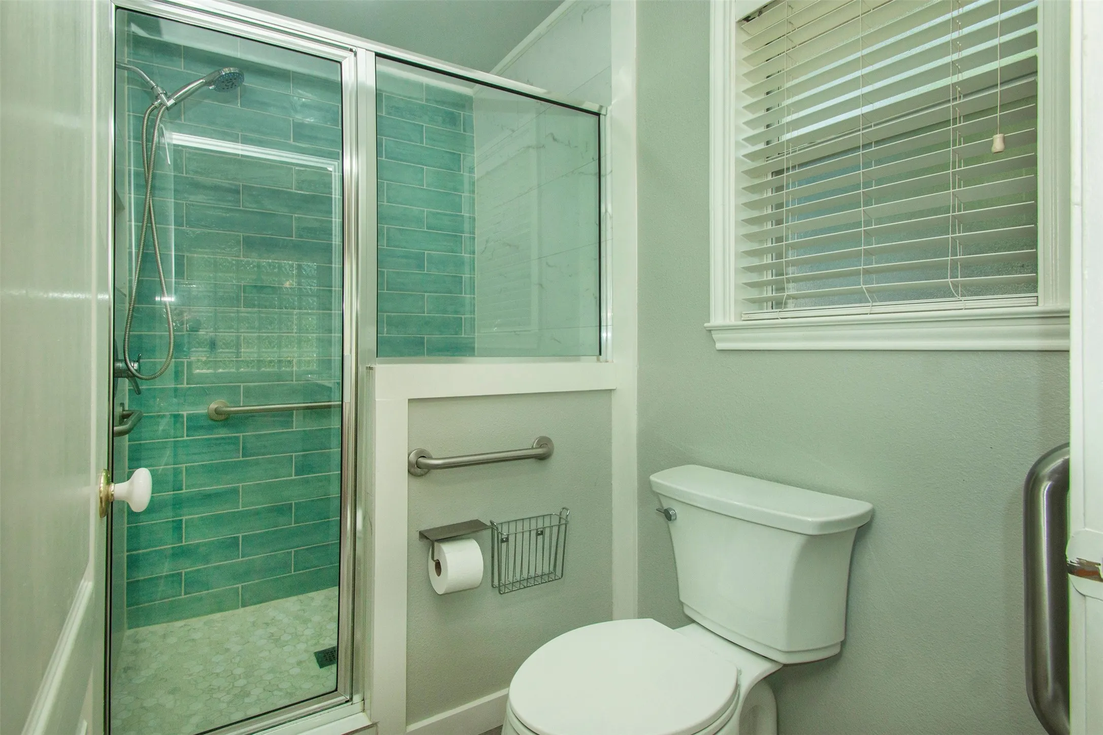 Primary bath with separate shower and toilet area