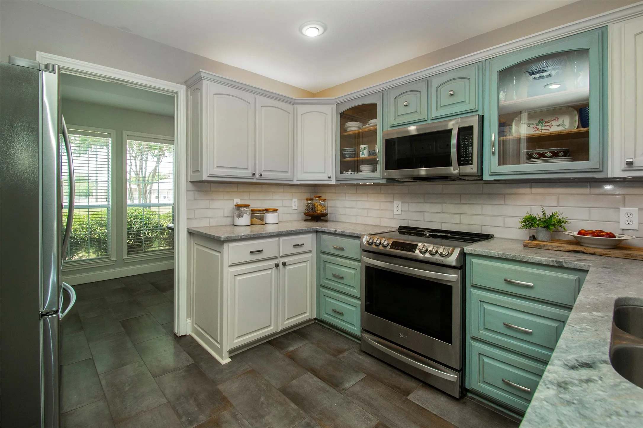 Updated appliances including the refrigerator that stays with the home