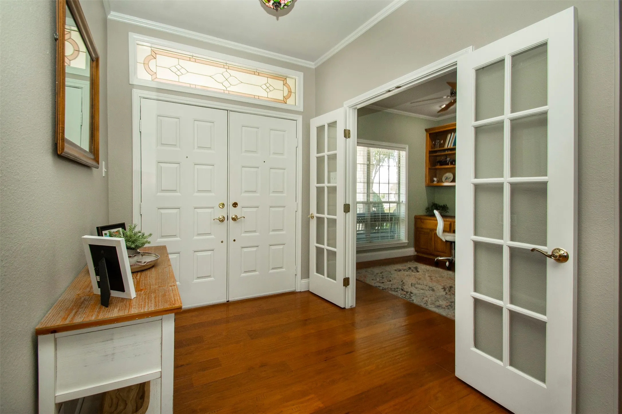 Large double door entry with access to the office