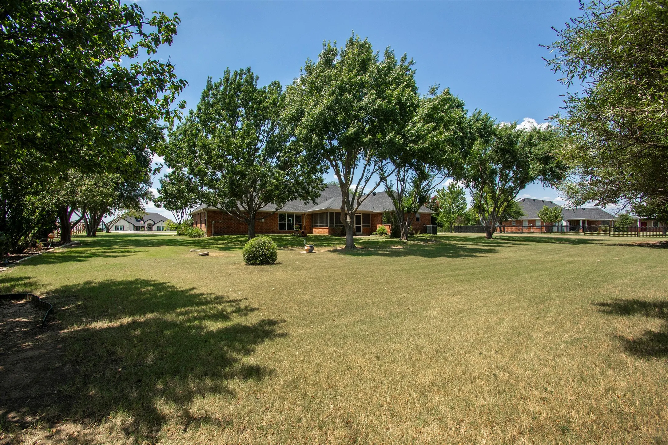 Private backyard with mature trees