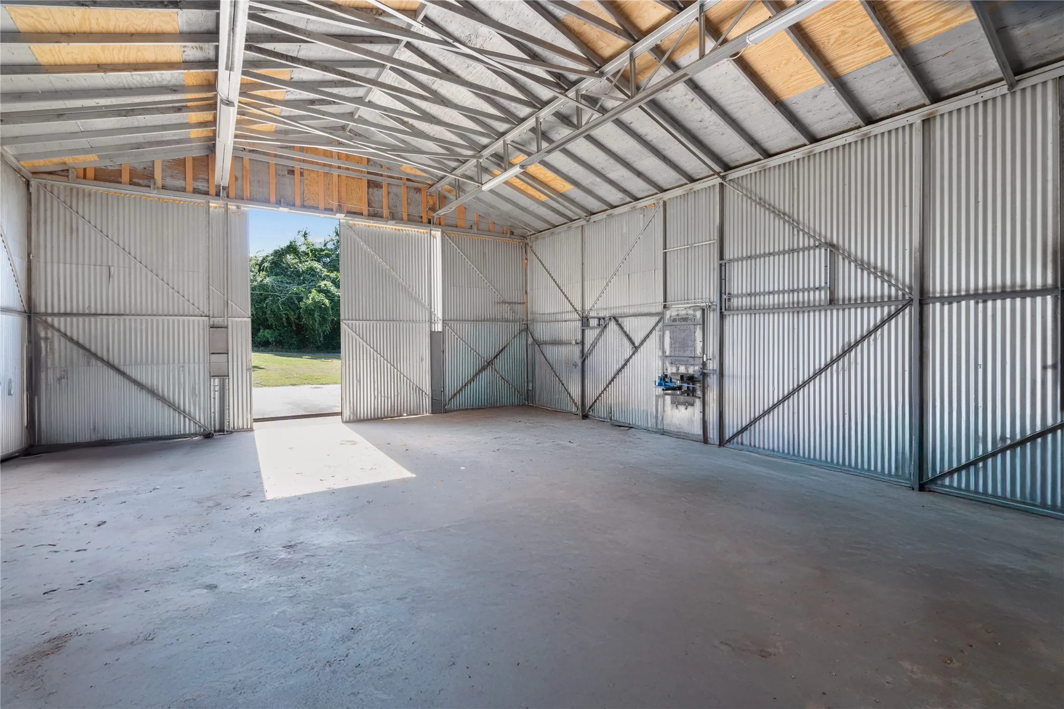 Garage featuring metal wall