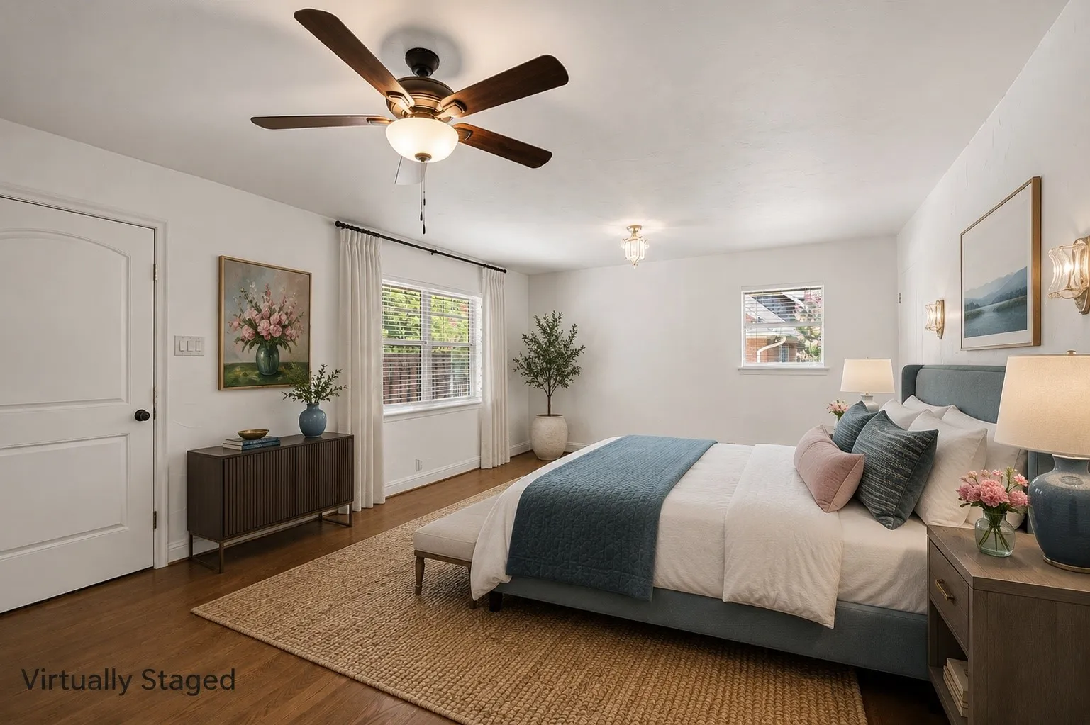 Virtually Staged Primary Suite has a door out to deck and backyard