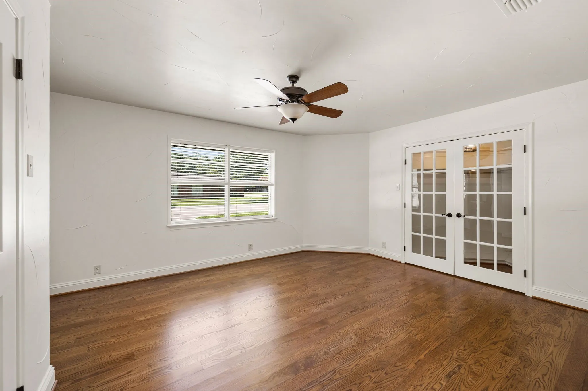 Gorgeous wood floors continue through the bedrooms