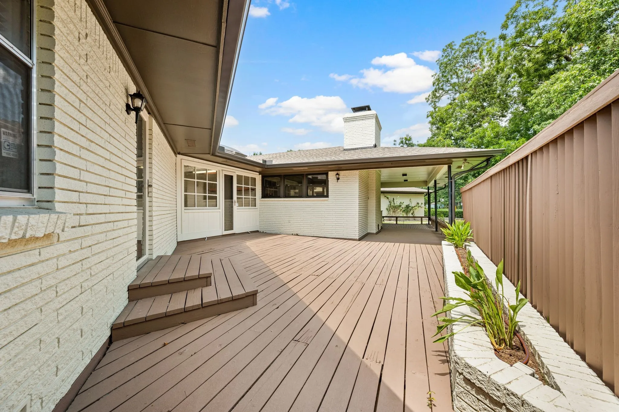Two decks, one off primary suite and the other off living and kitchen