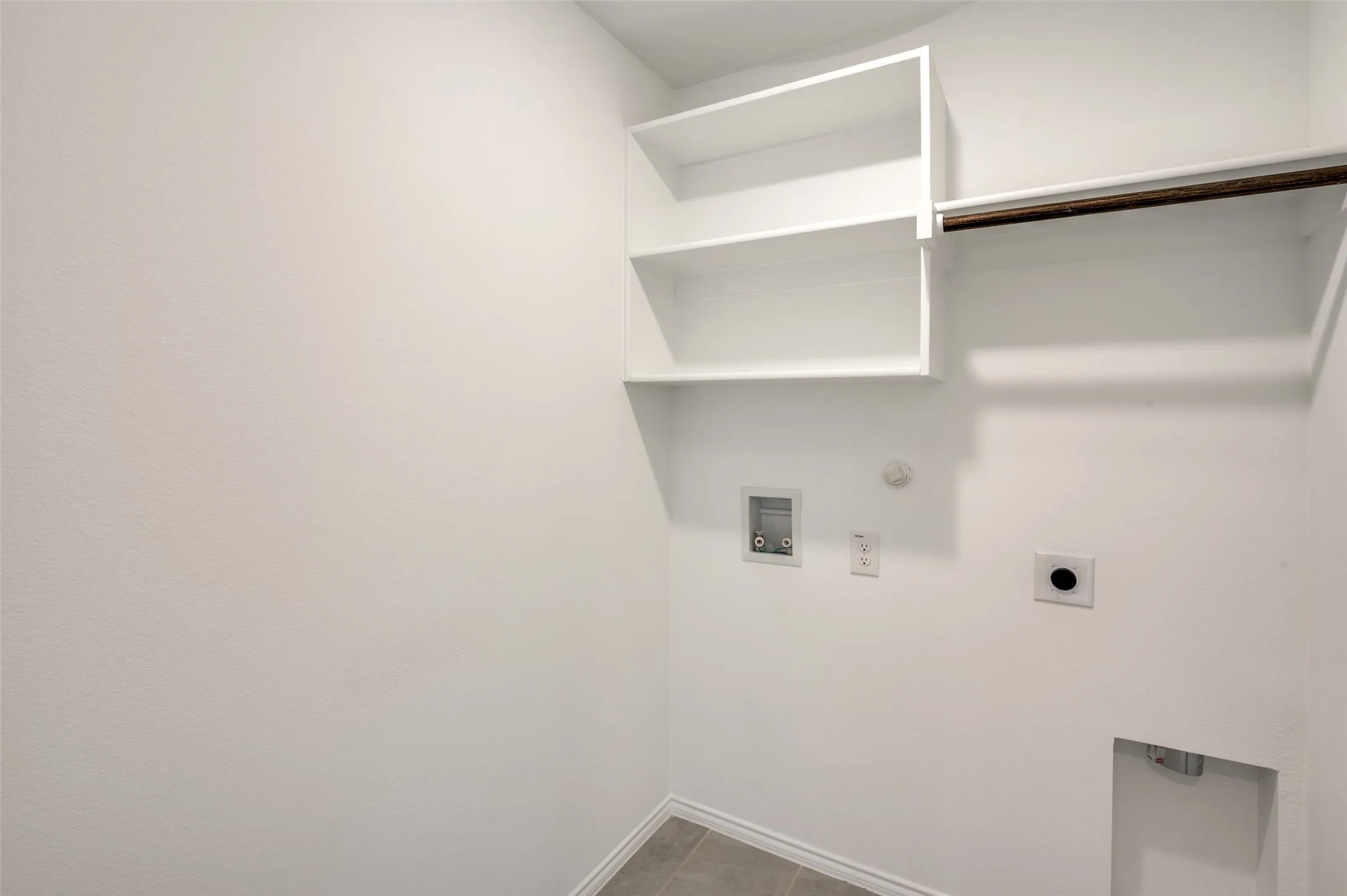 Built-in shelving, hanging rod, and utility connections
