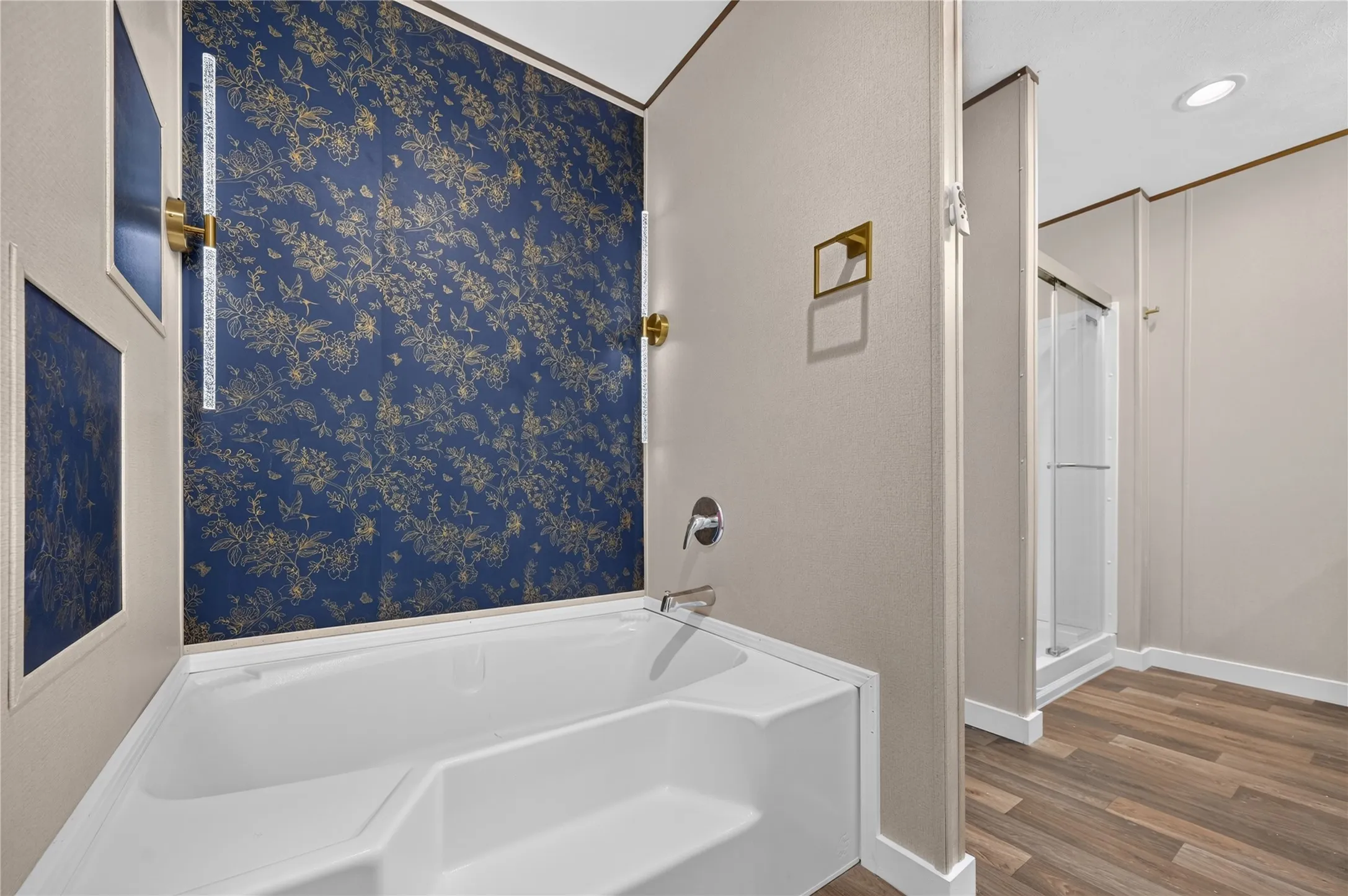 White built-in bathtub with chrome fixtures