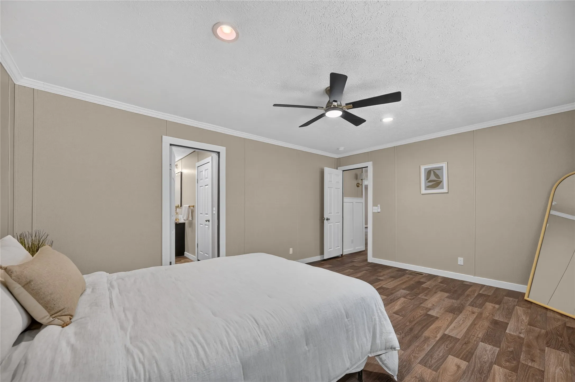 Wood-finish flooring, recessed lighting, and a ceiling fan with integrated lighting