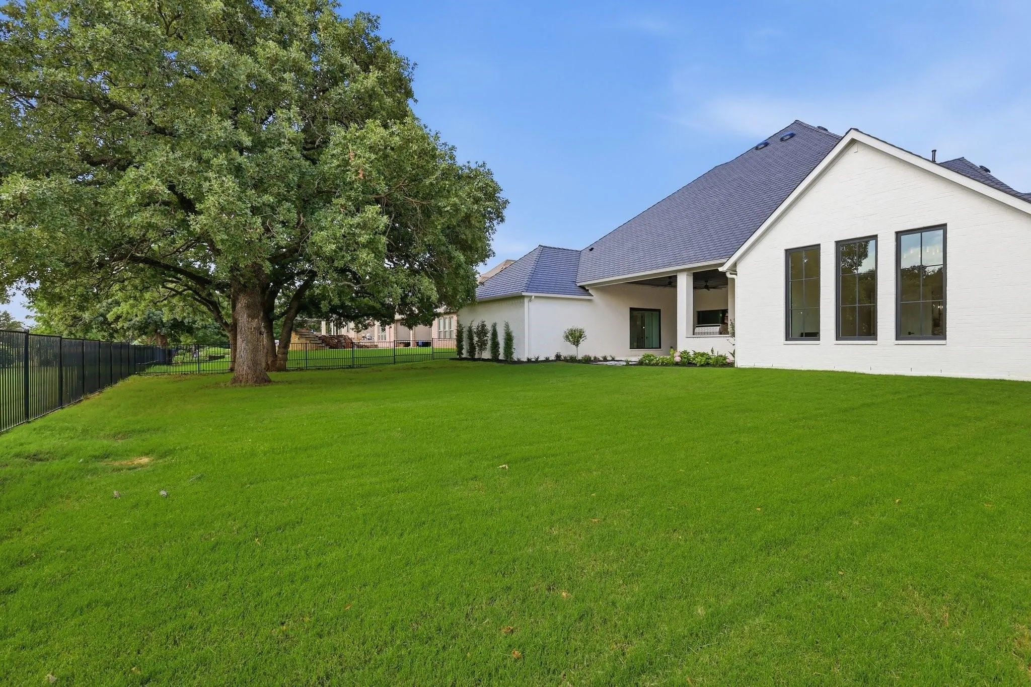 Beautifully maintained Backyard with ample green space for play, pets, or future possibilities.