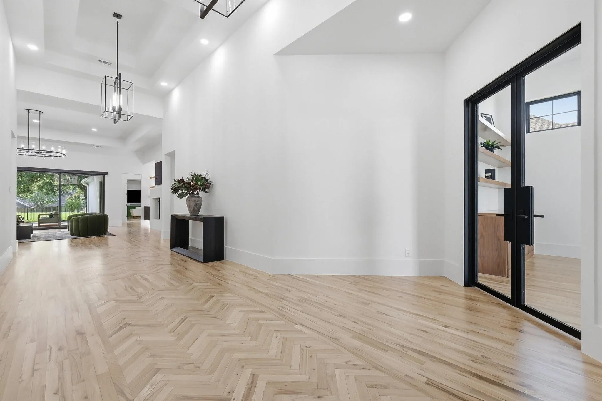 Durable nail-down Solid Red Oak hardwood floors with a refined white satin finish extend throughout the home.